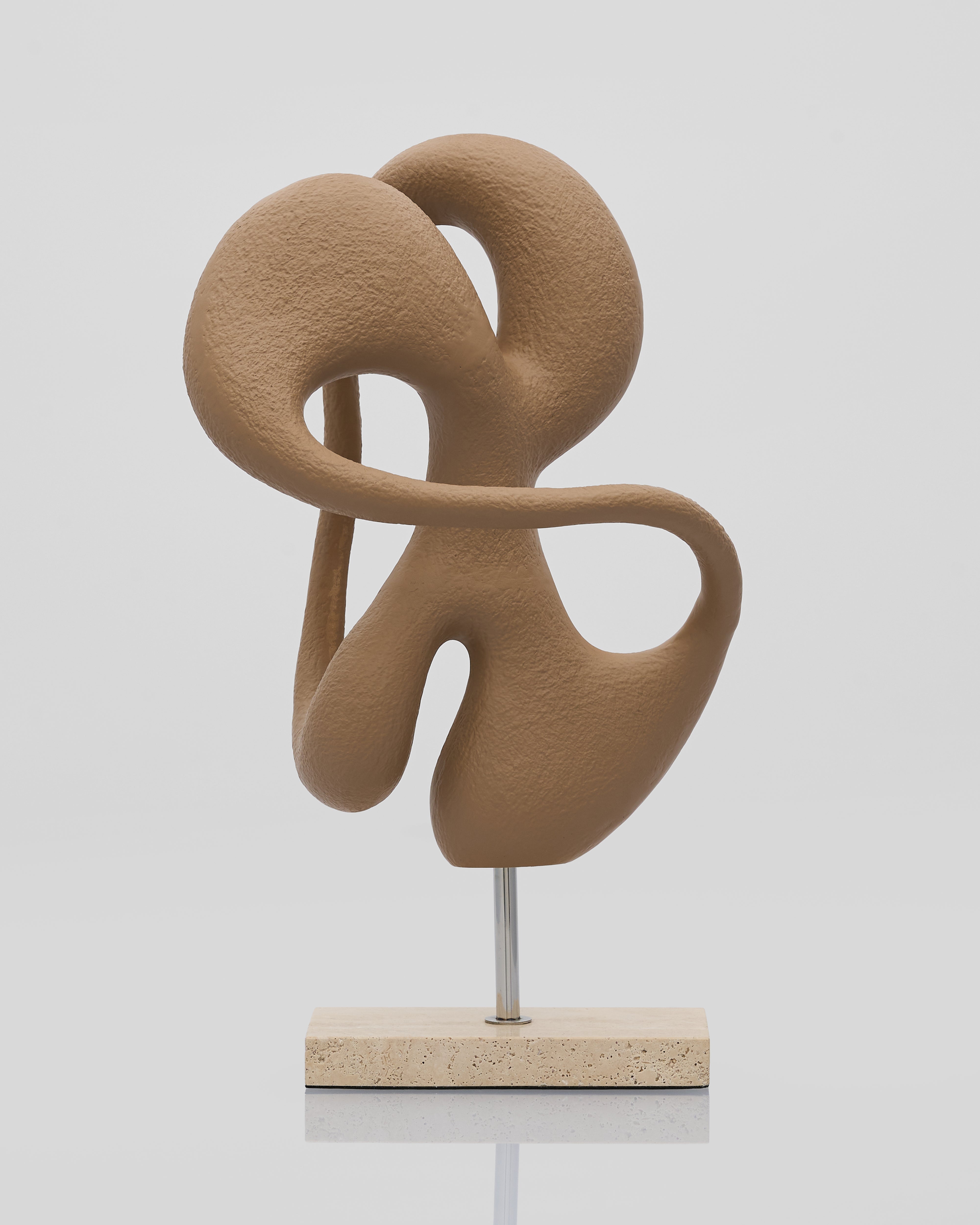 Brown abstract sculpture on a white background