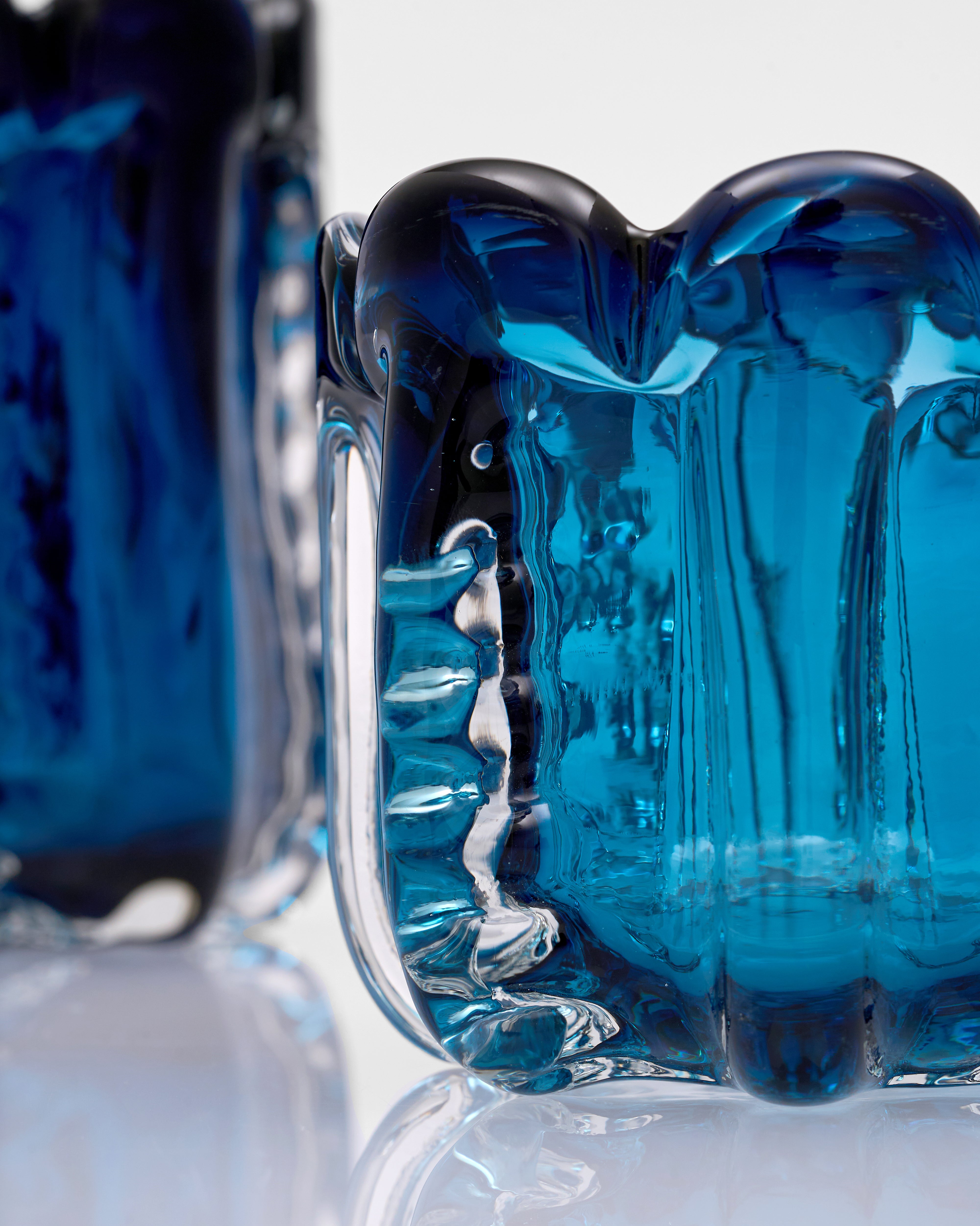 Close-up of a blue glass object with a textured surface