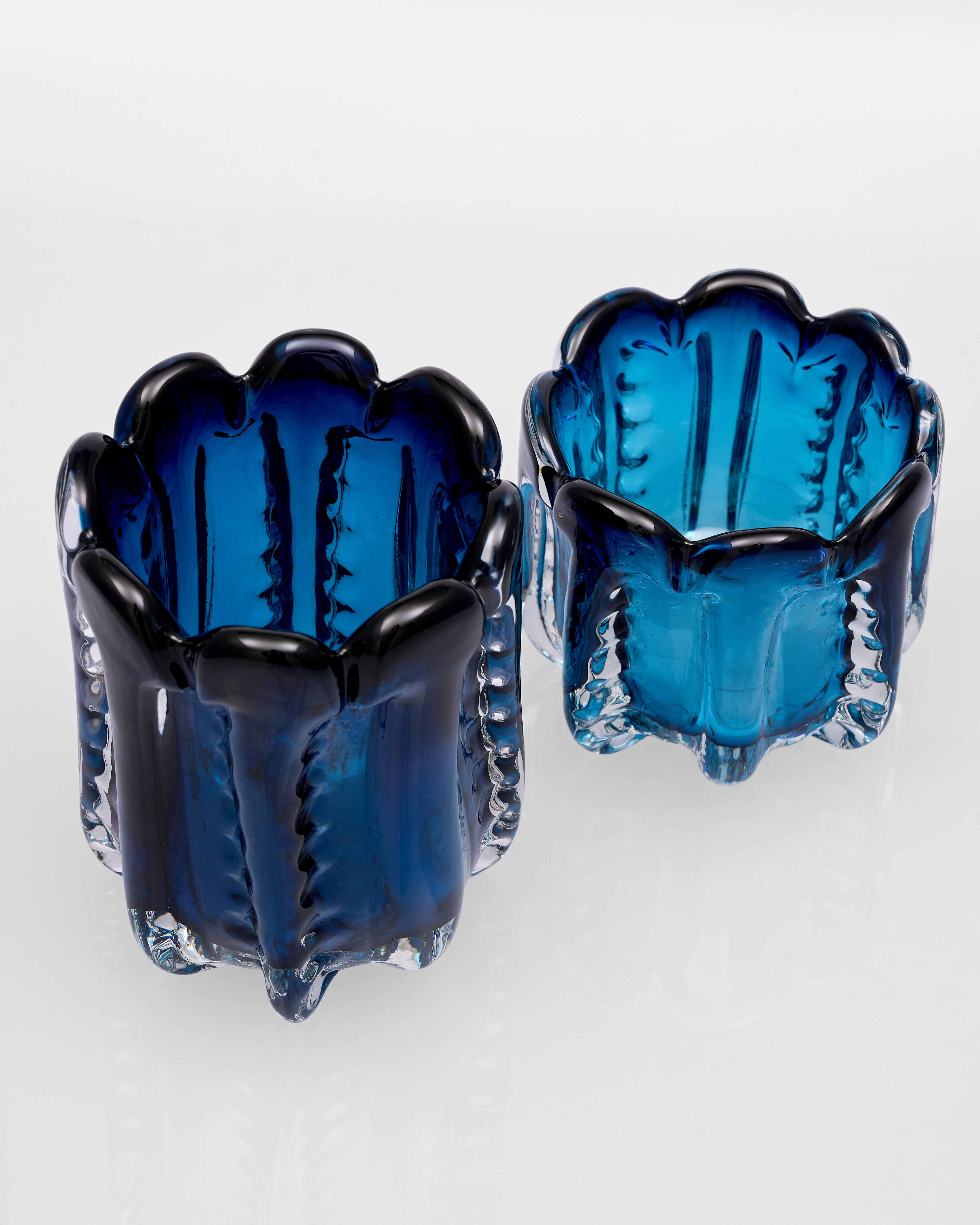 Pair of blue glass Albaro Navy Blue Crystal Decor Set on a white background
