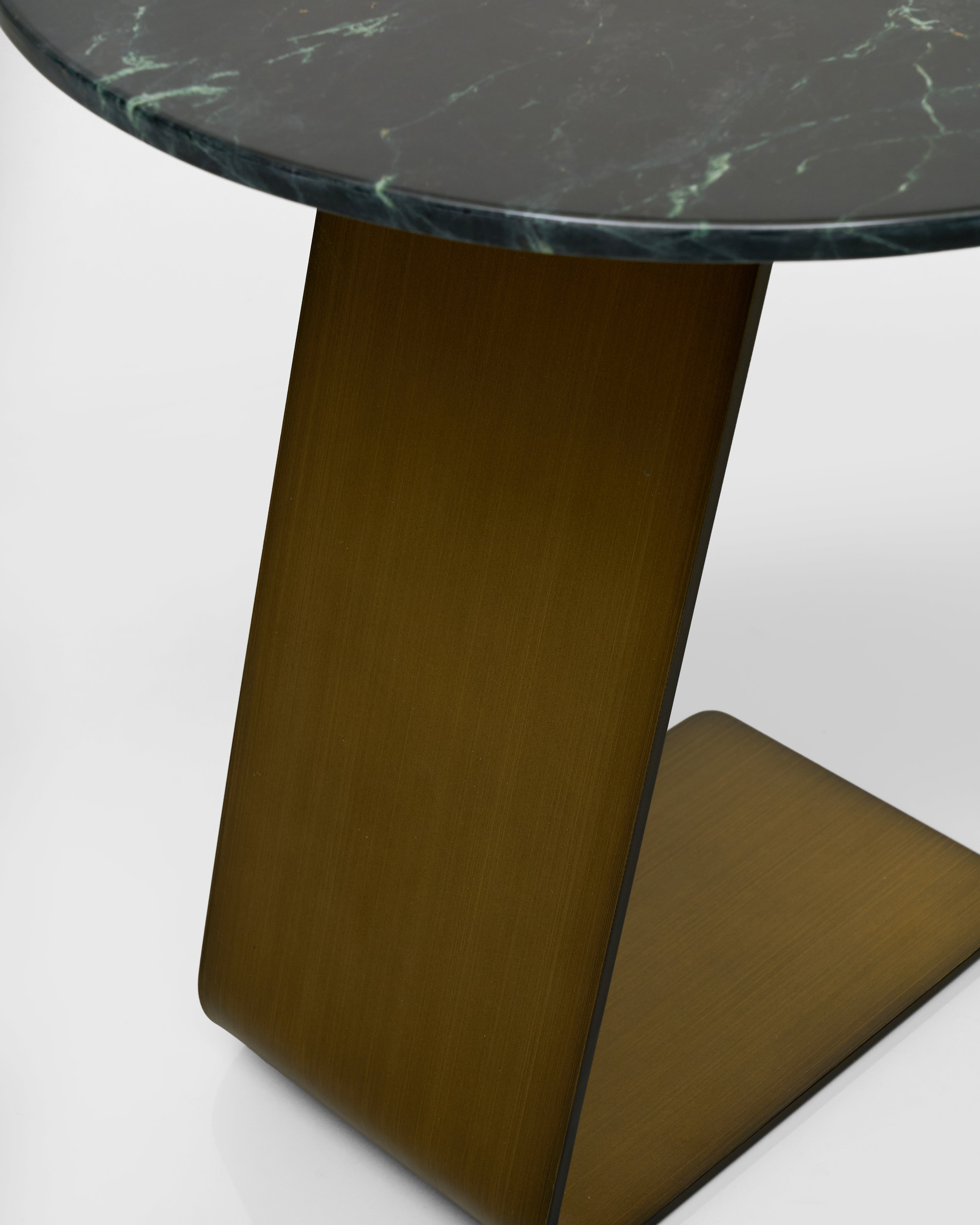 Round table with marble top and wooden base on a white background