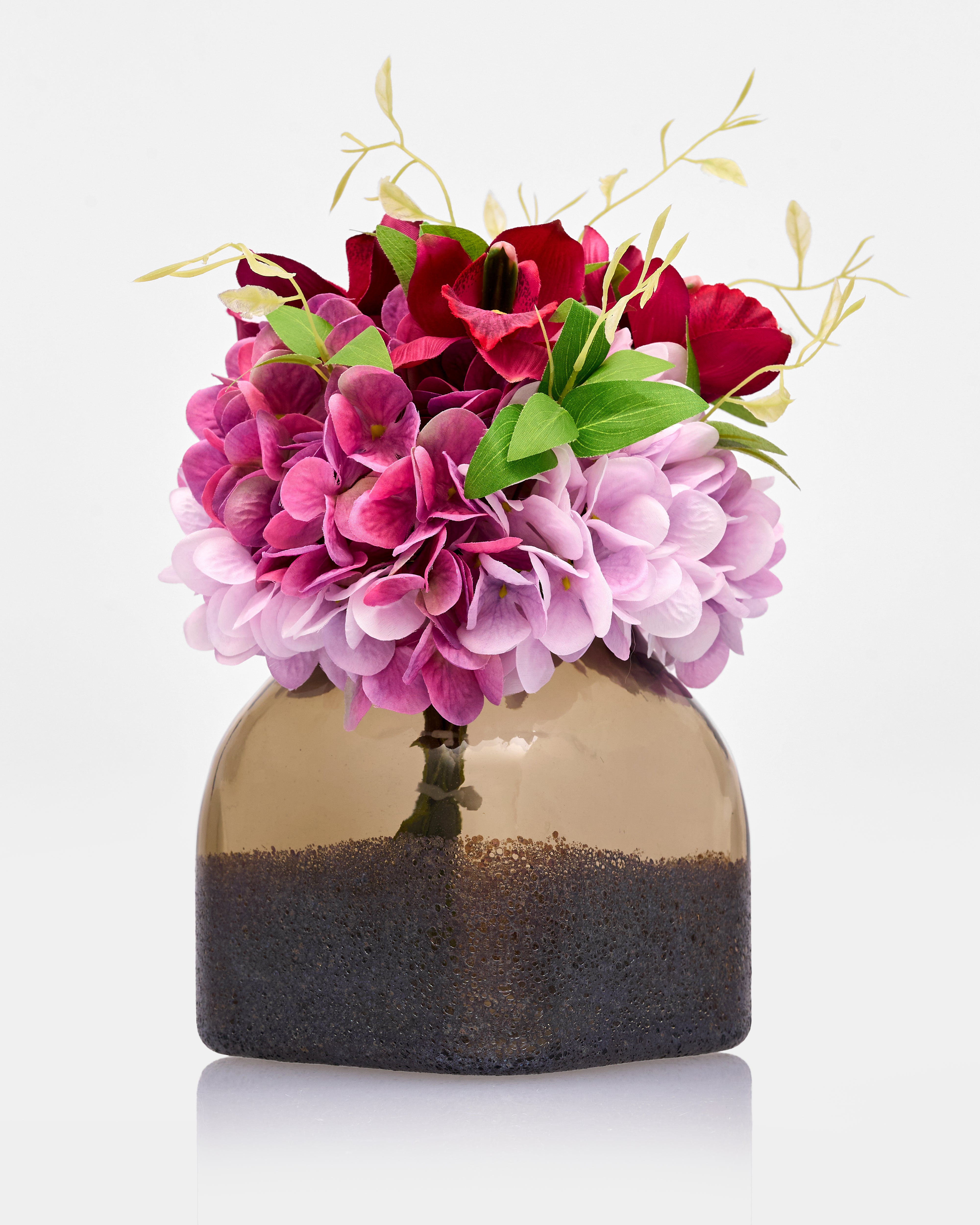 Decorative vase with pink and red flowers on a white background