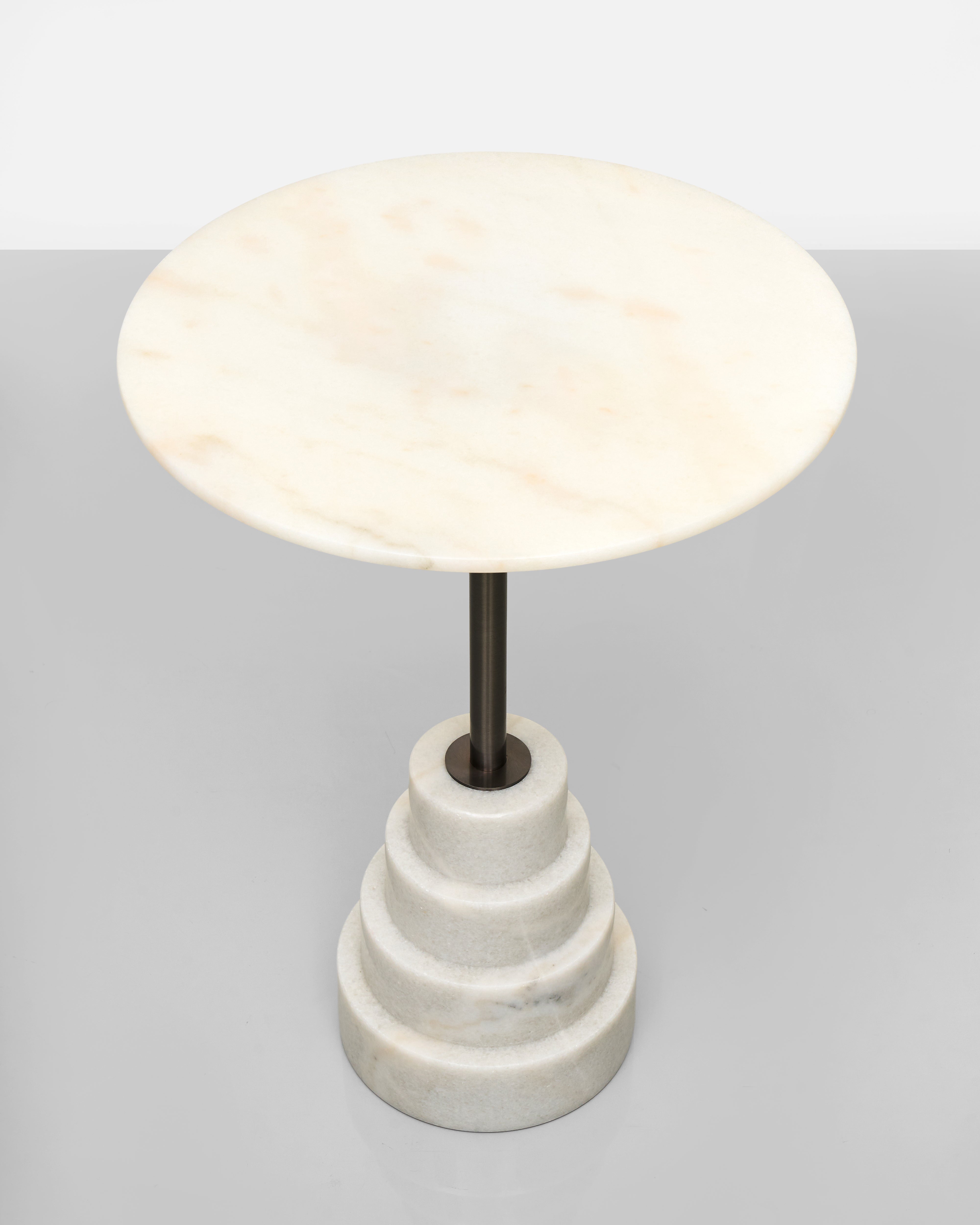 Marble side table with a round white shade on a gray background