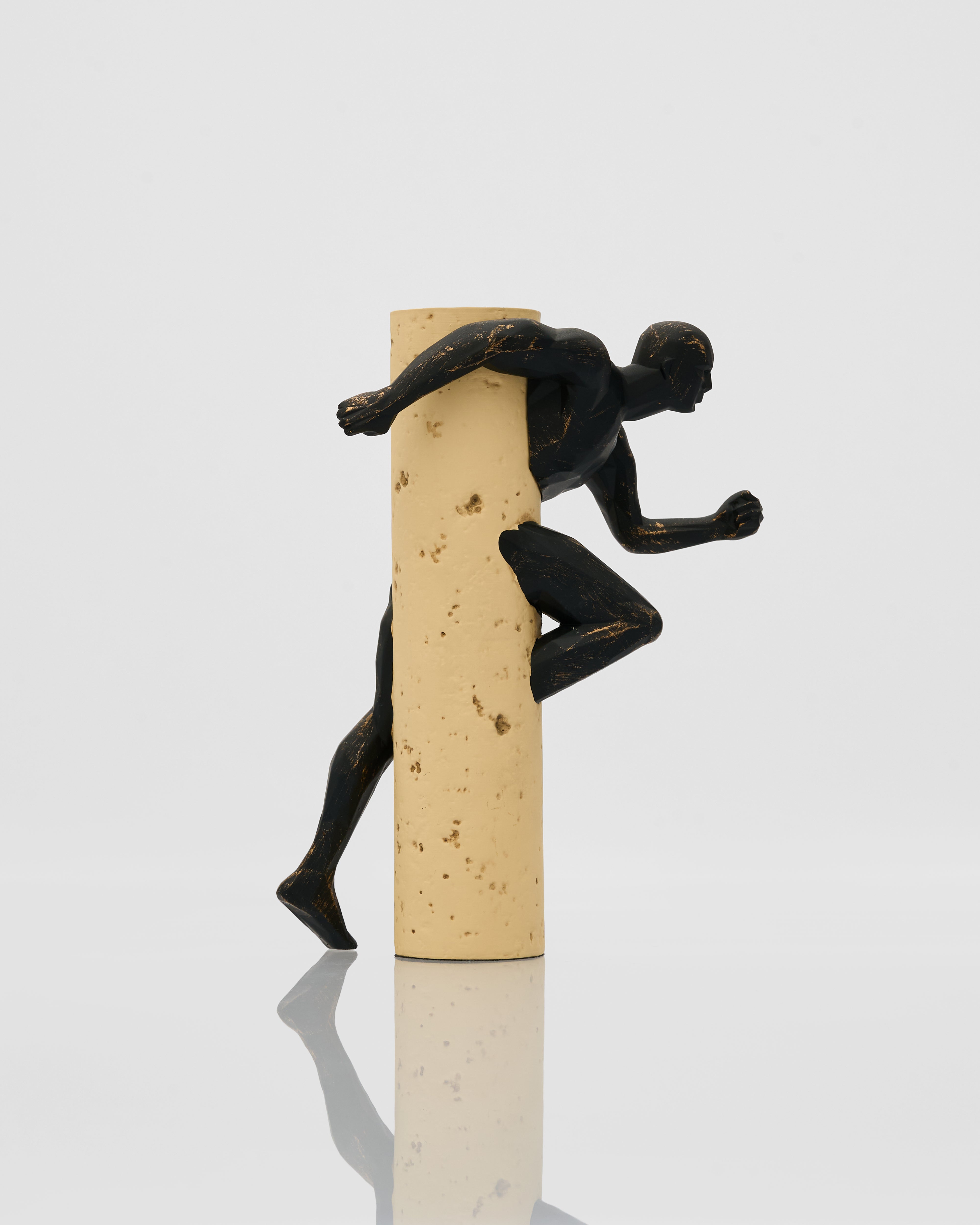 Black figurine carved on a wood cut on a white background