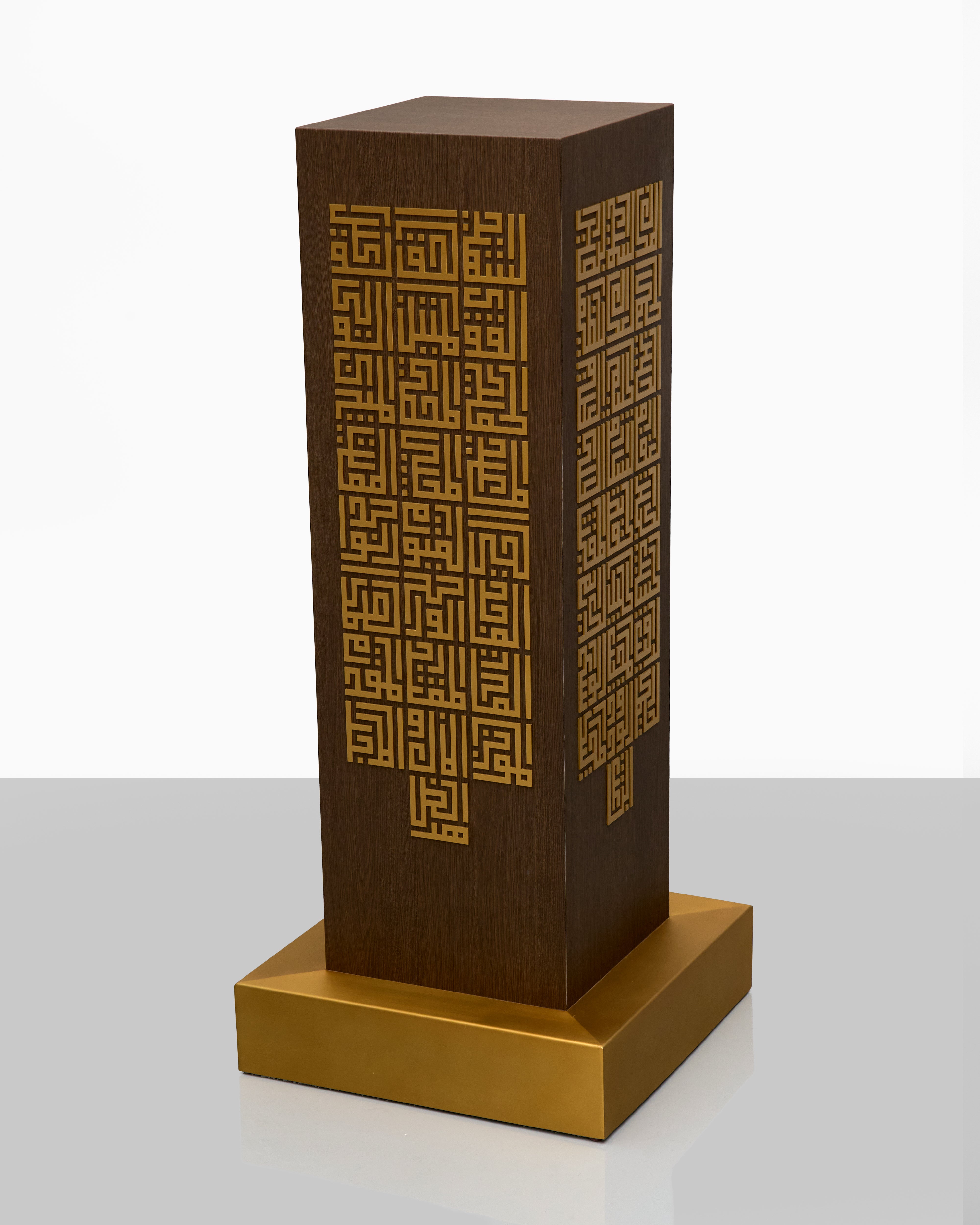 Decorative brown and gold pedestal with geometric pattern on a white background