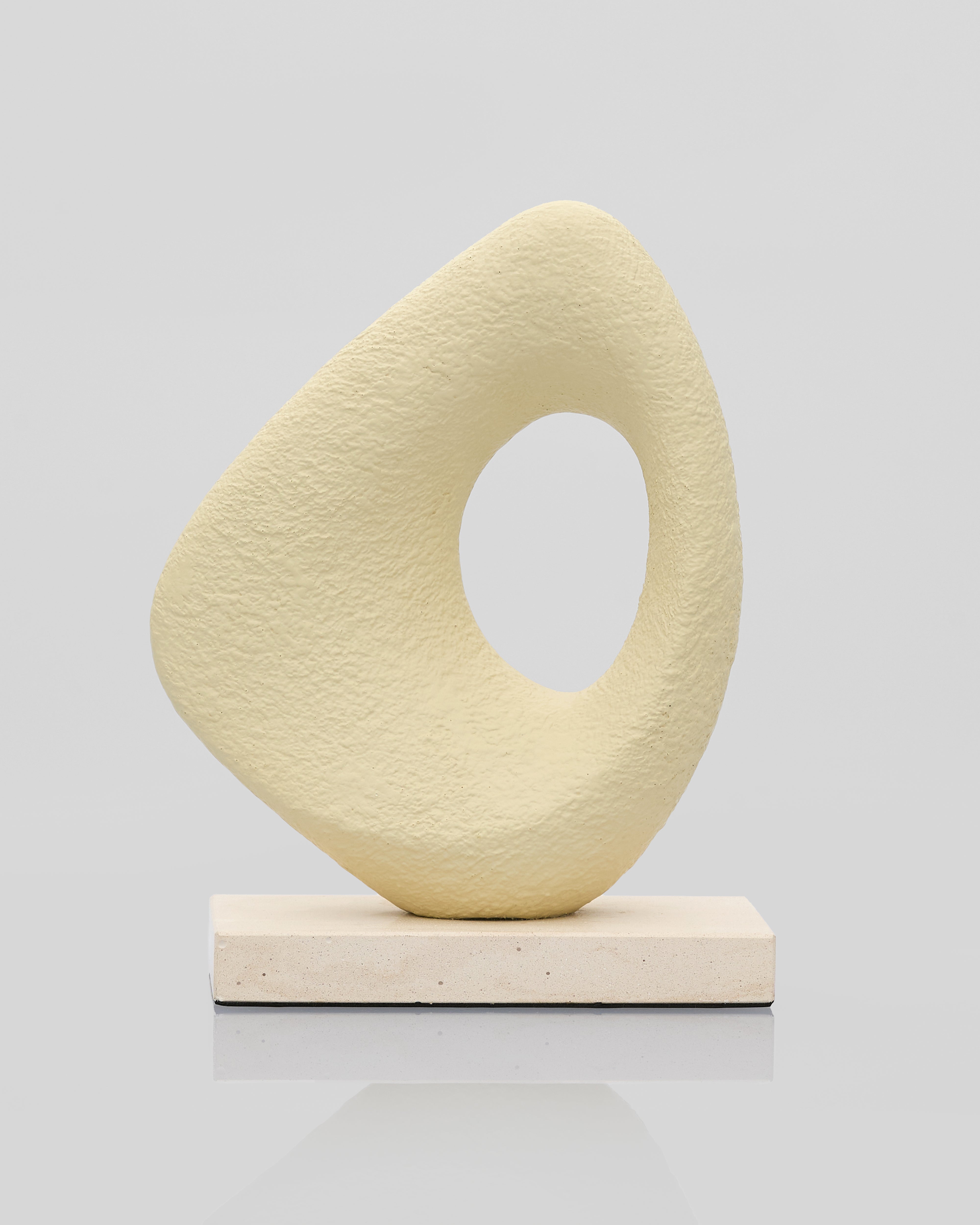 Abstract beige sculpture on a light gray background mini sculpture