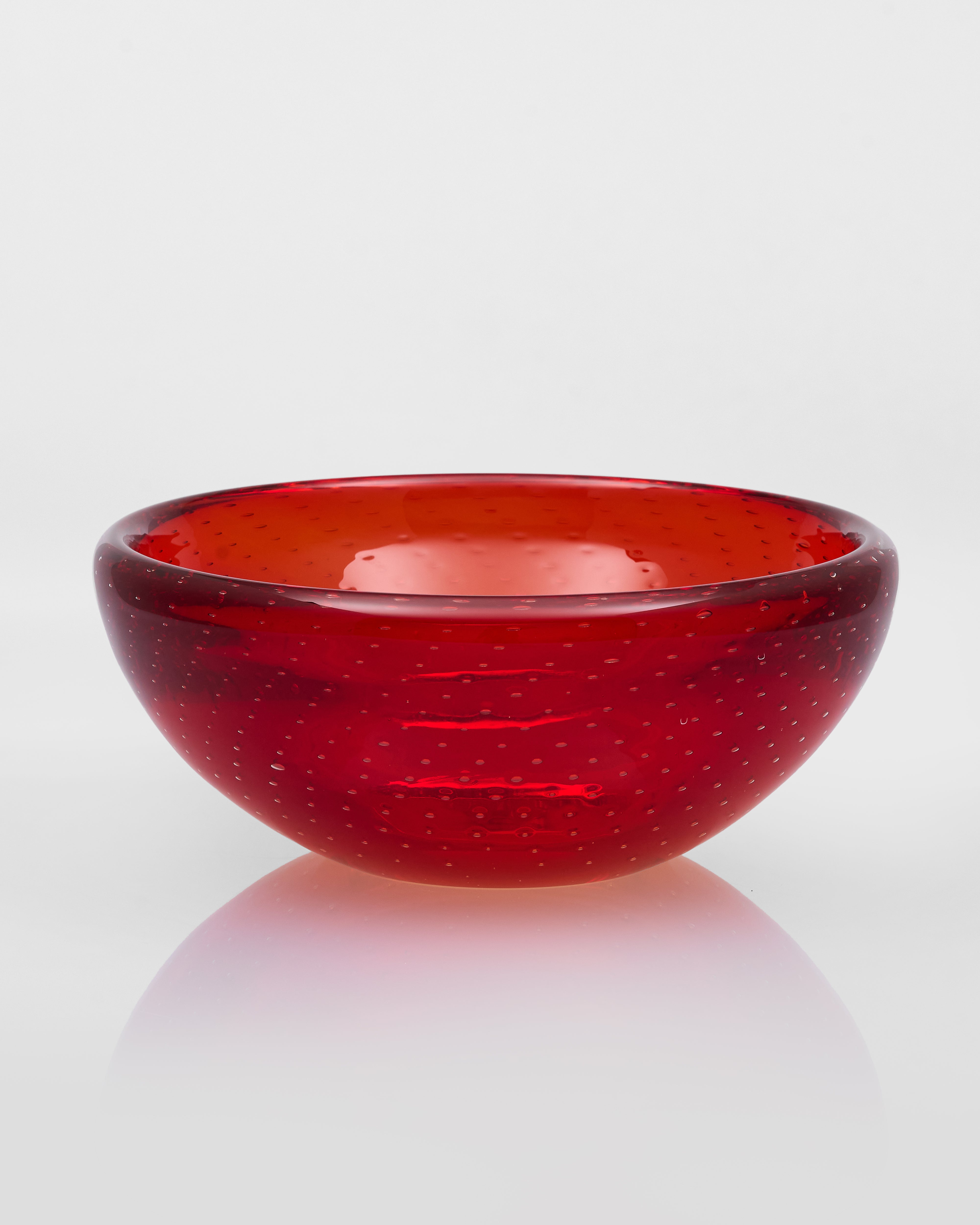 Red glass bowl on a white background