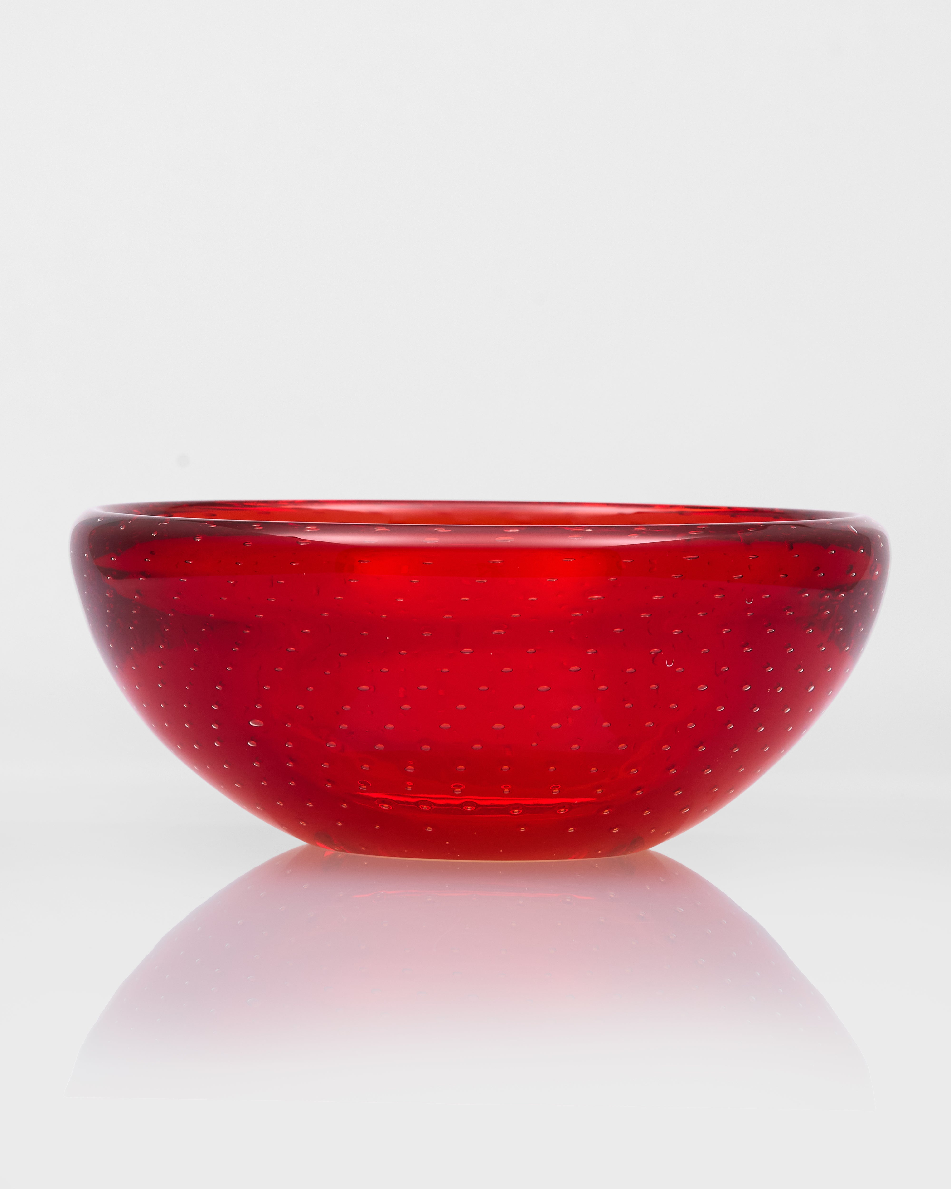 Red glass bowl on a white background