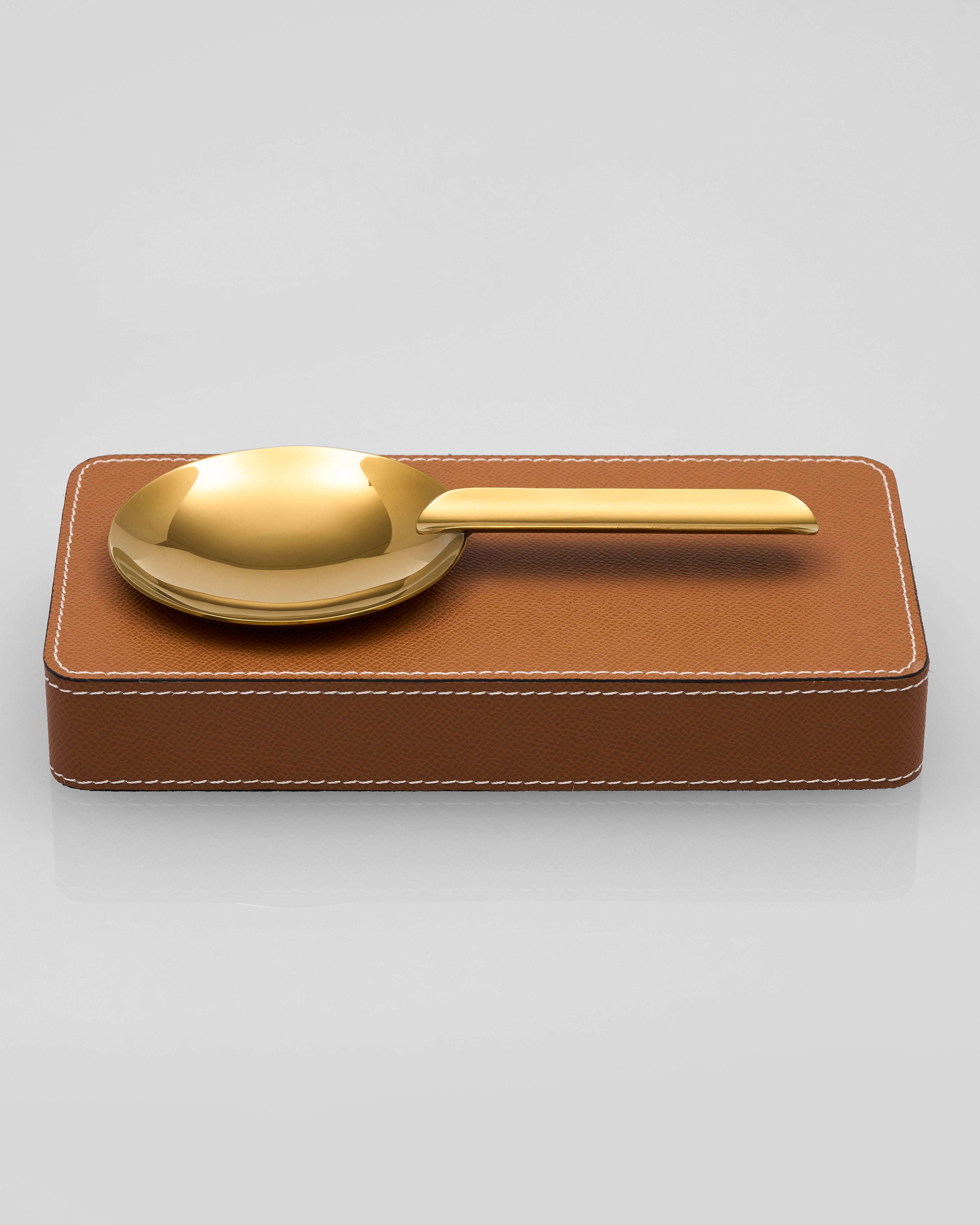 Gelo Leather Ashtray on a brown leather tray with a white background