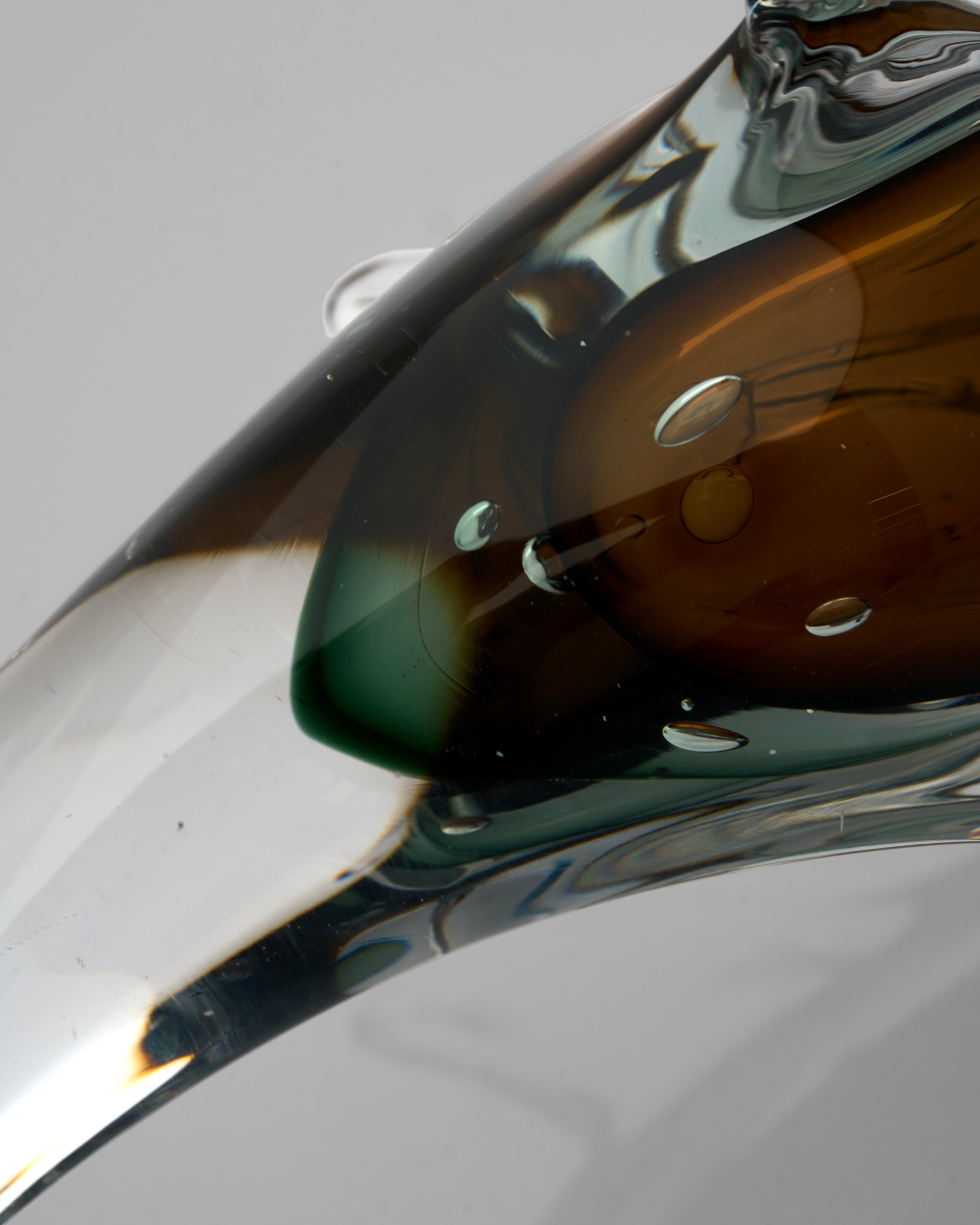 Close-up of a reflective metallic object on a gray background