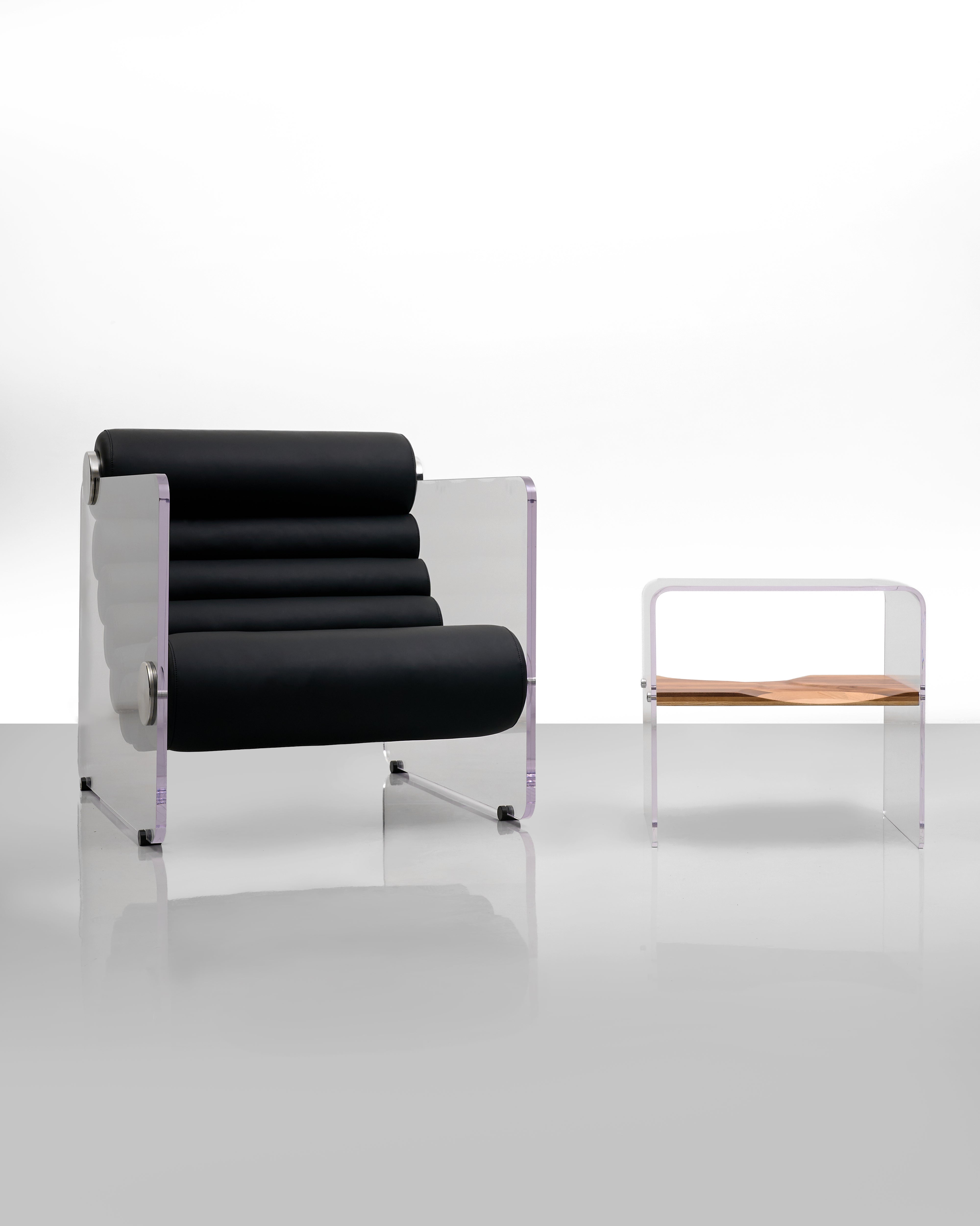 Modern black chair with metallic frame on a white background