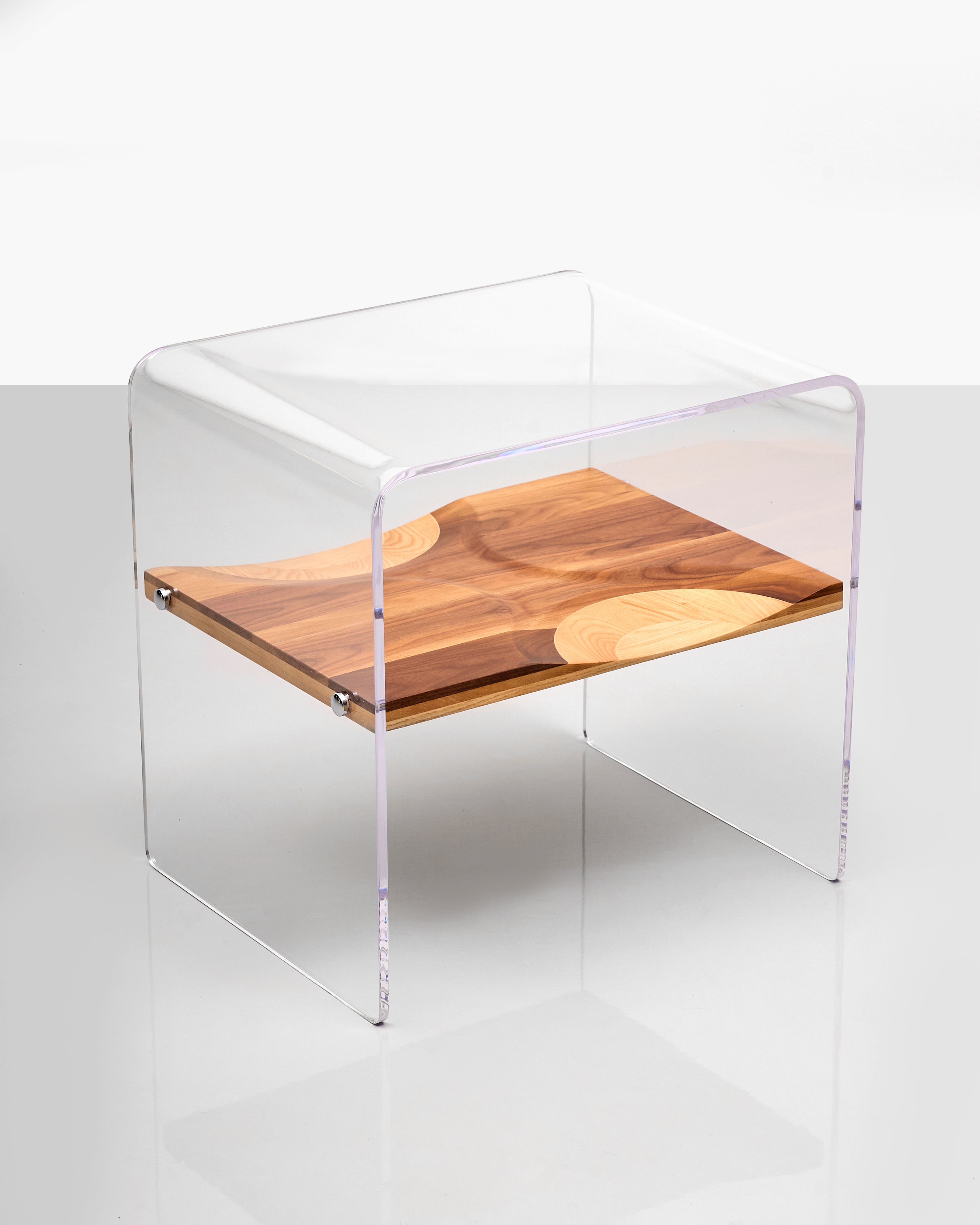Clear acrylic side table with wooden shelf on a white background