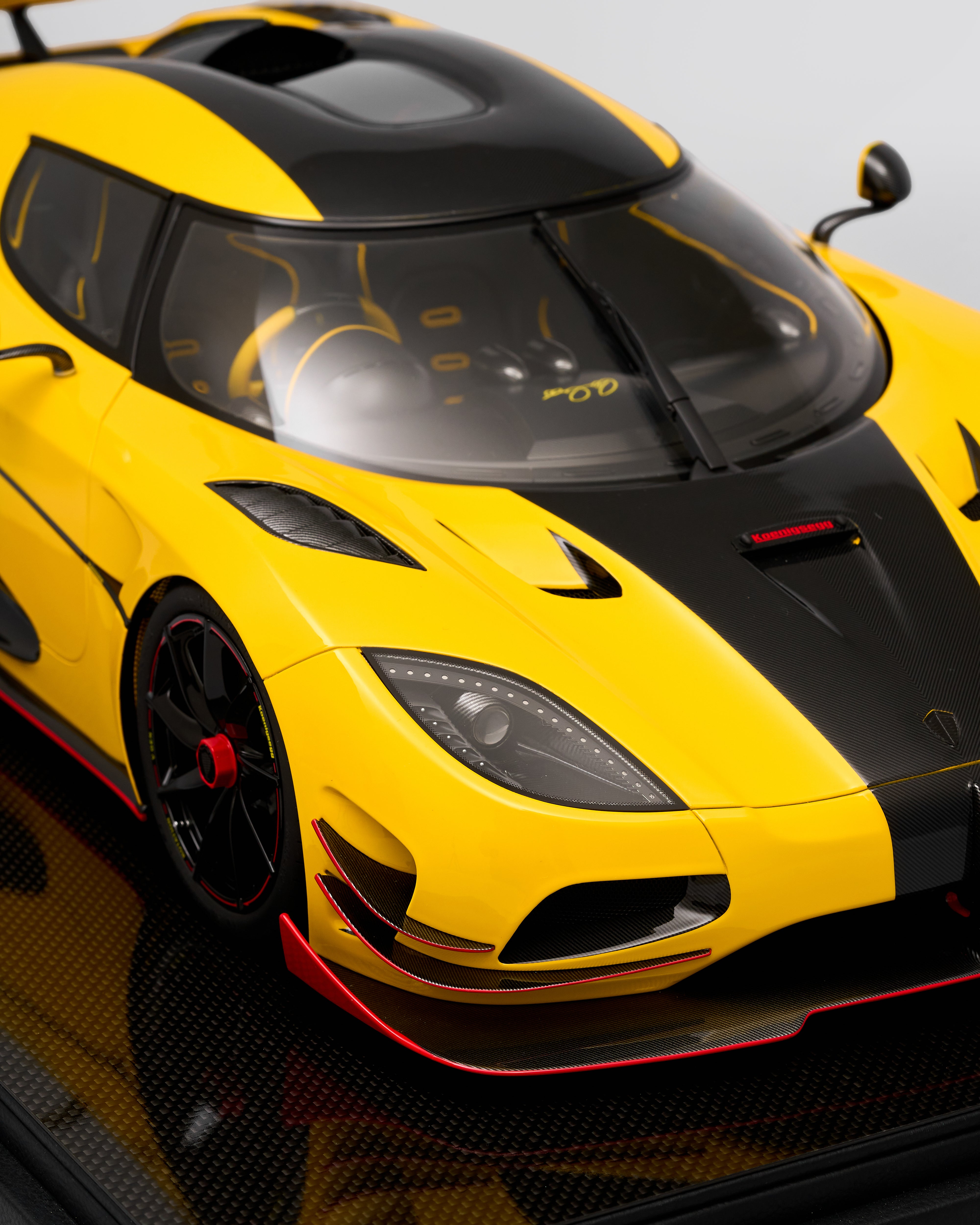 Yellow and black sports car with a sleek design