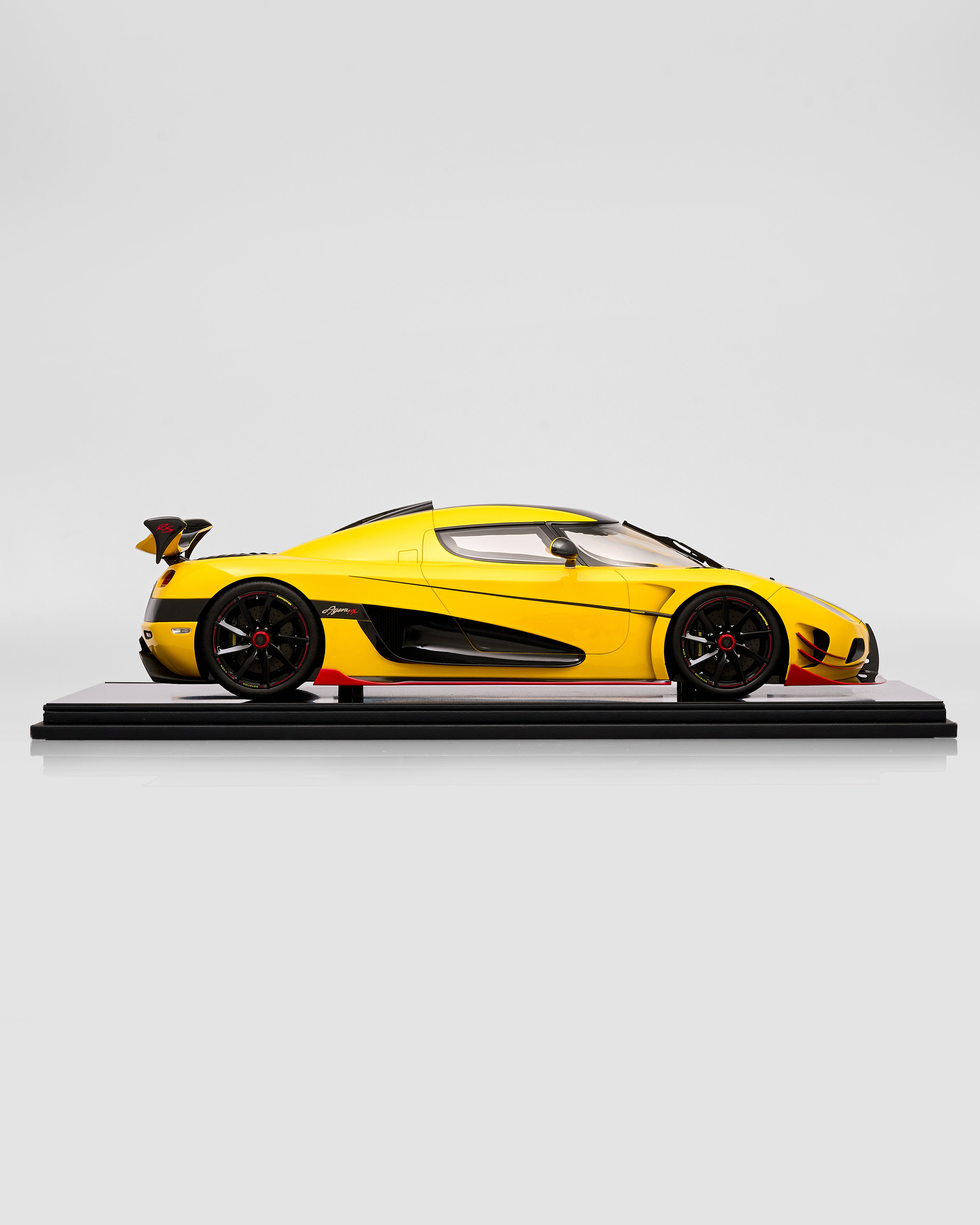Yellow sports car model on a white background