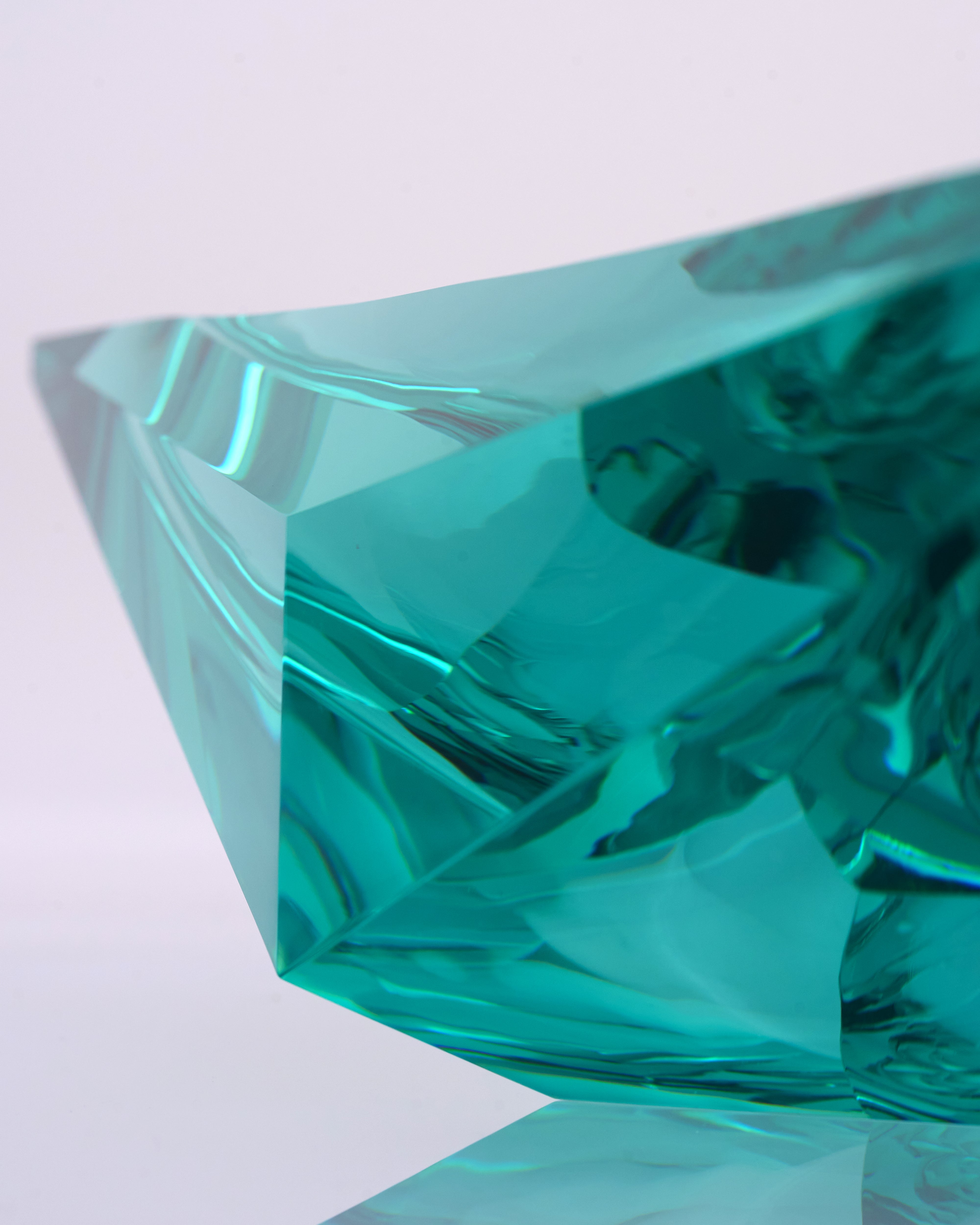 Teal crystal on a white background