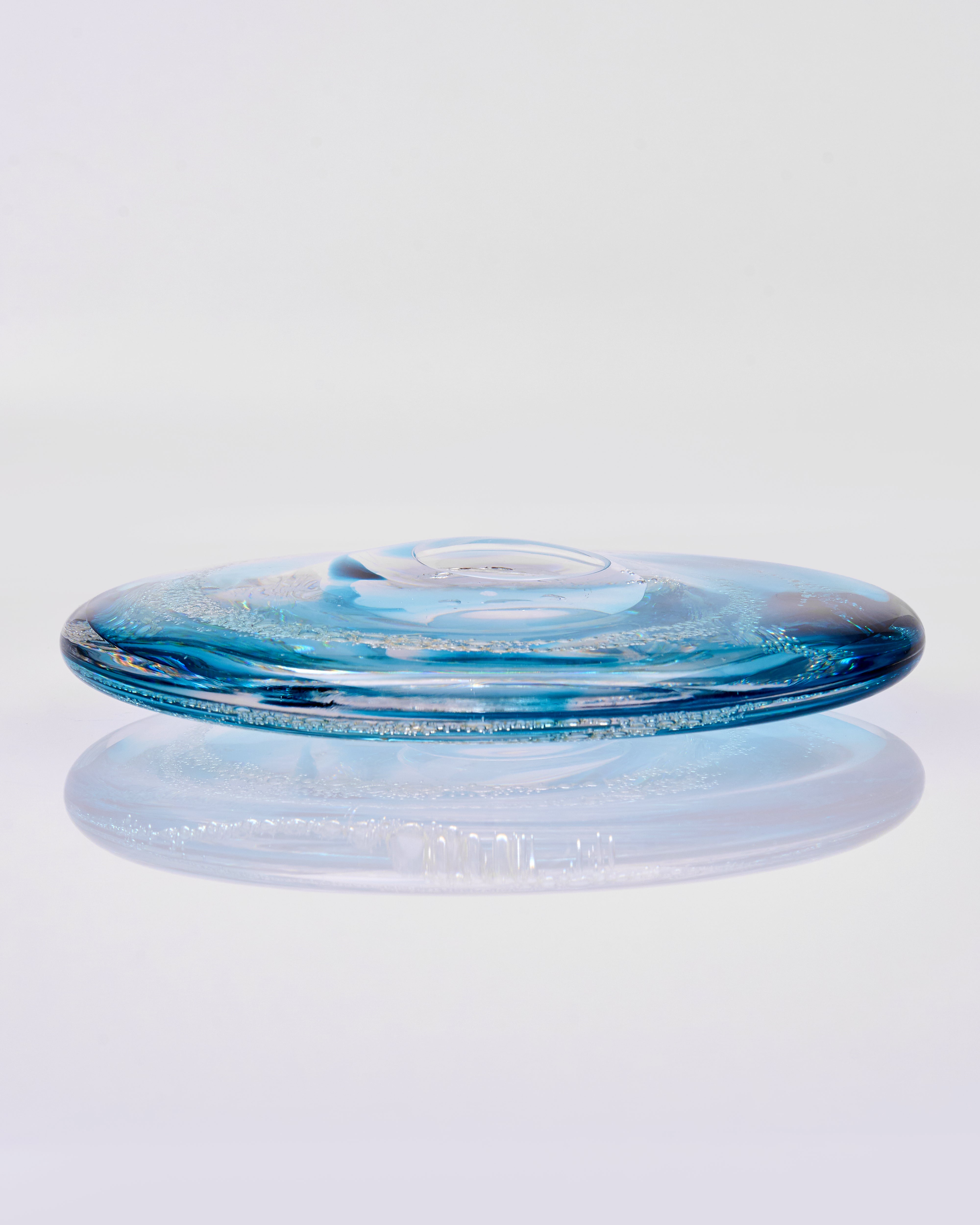 Blue glass dish on a white background
