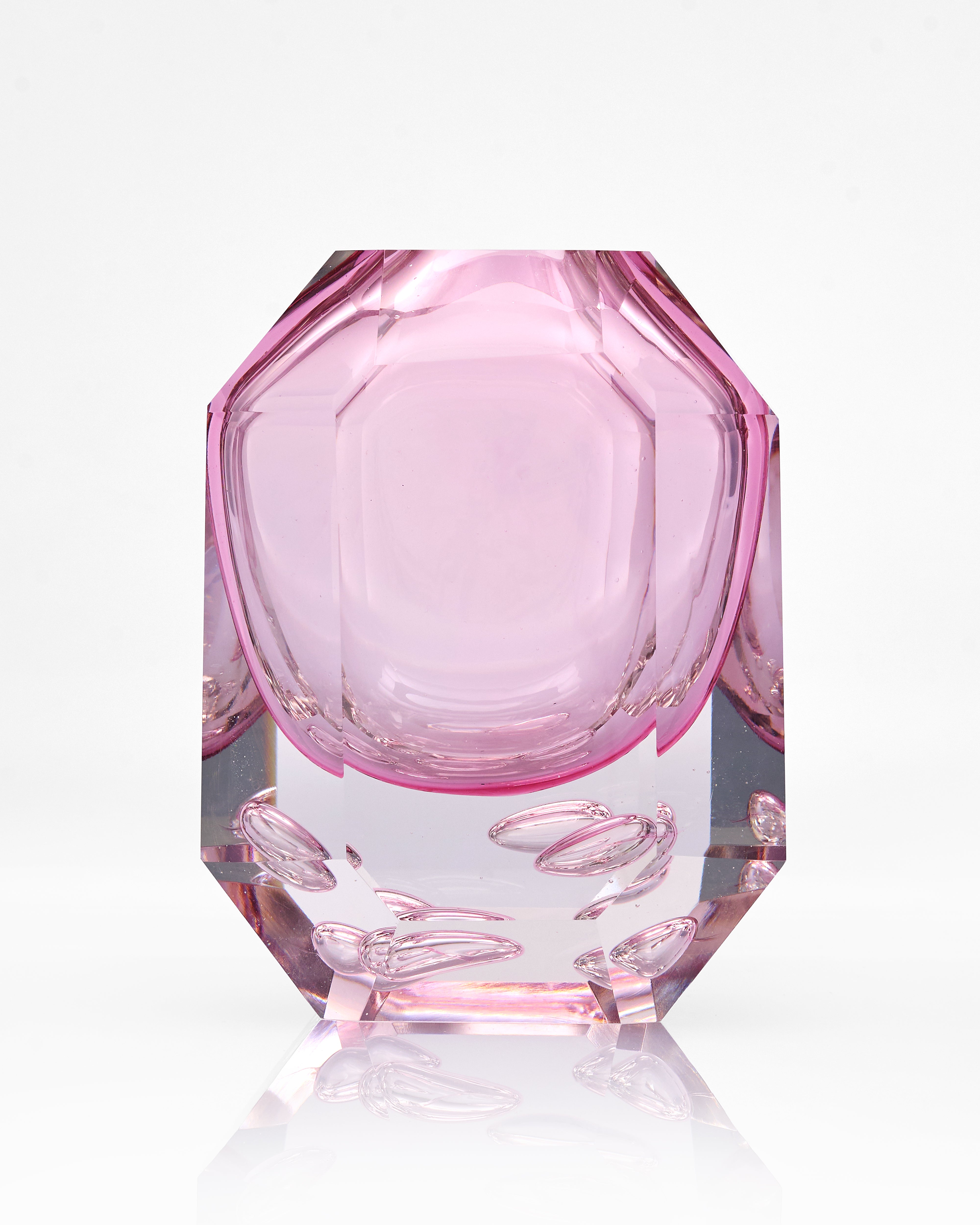 Pink octagonal glass object on a white background