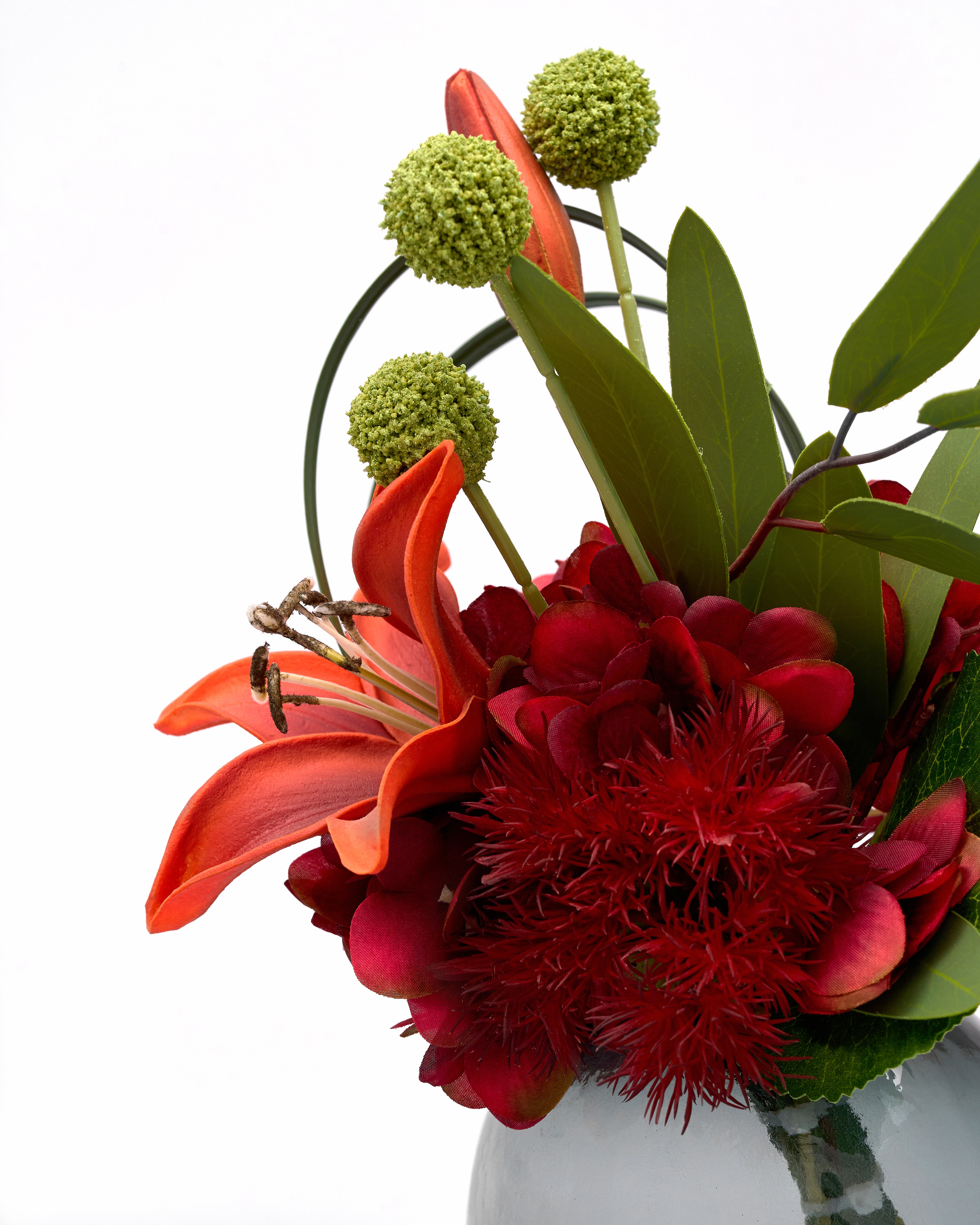Bouquet of red and green flowers with a white background