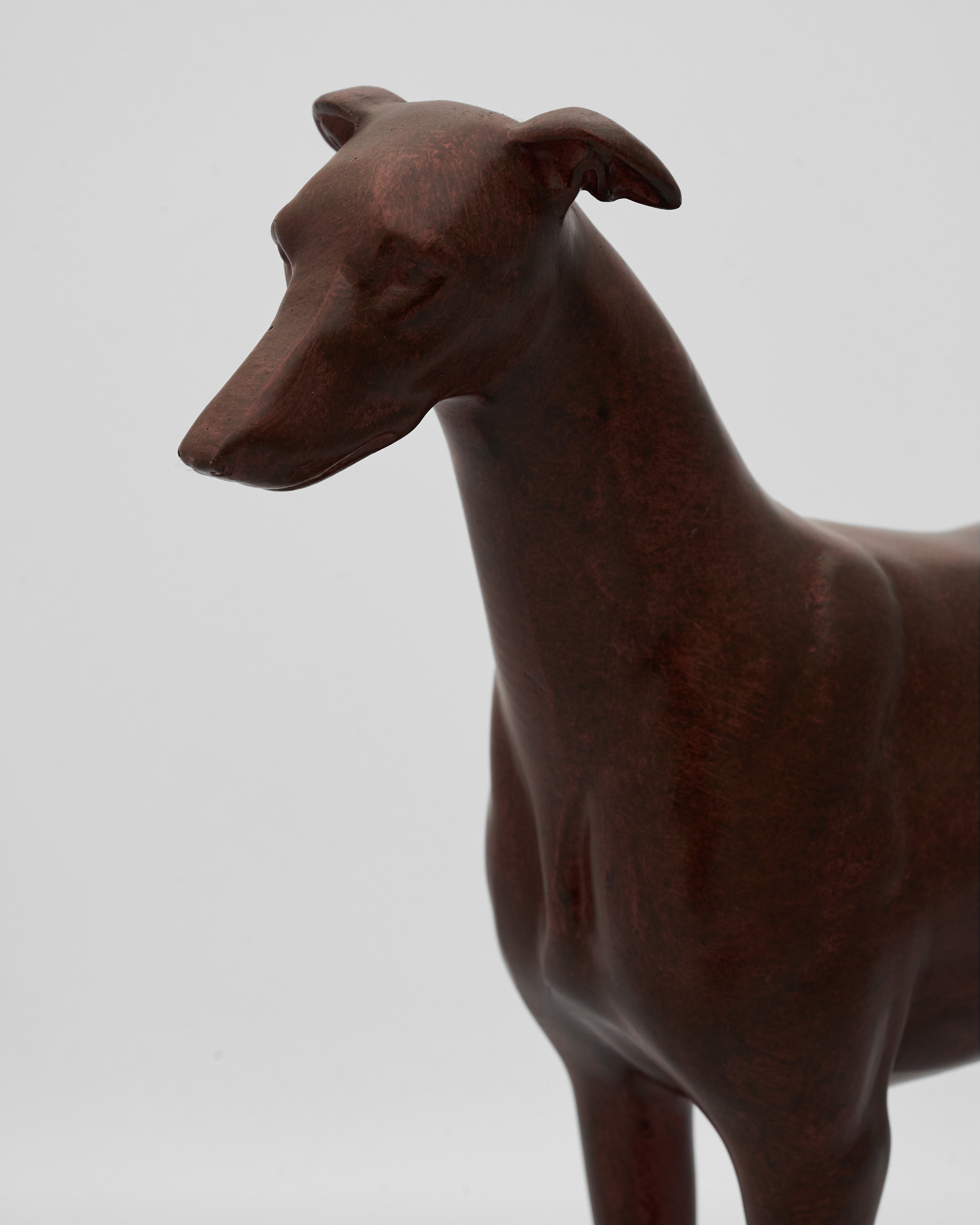 wooden sculpture of a dog on a plain background