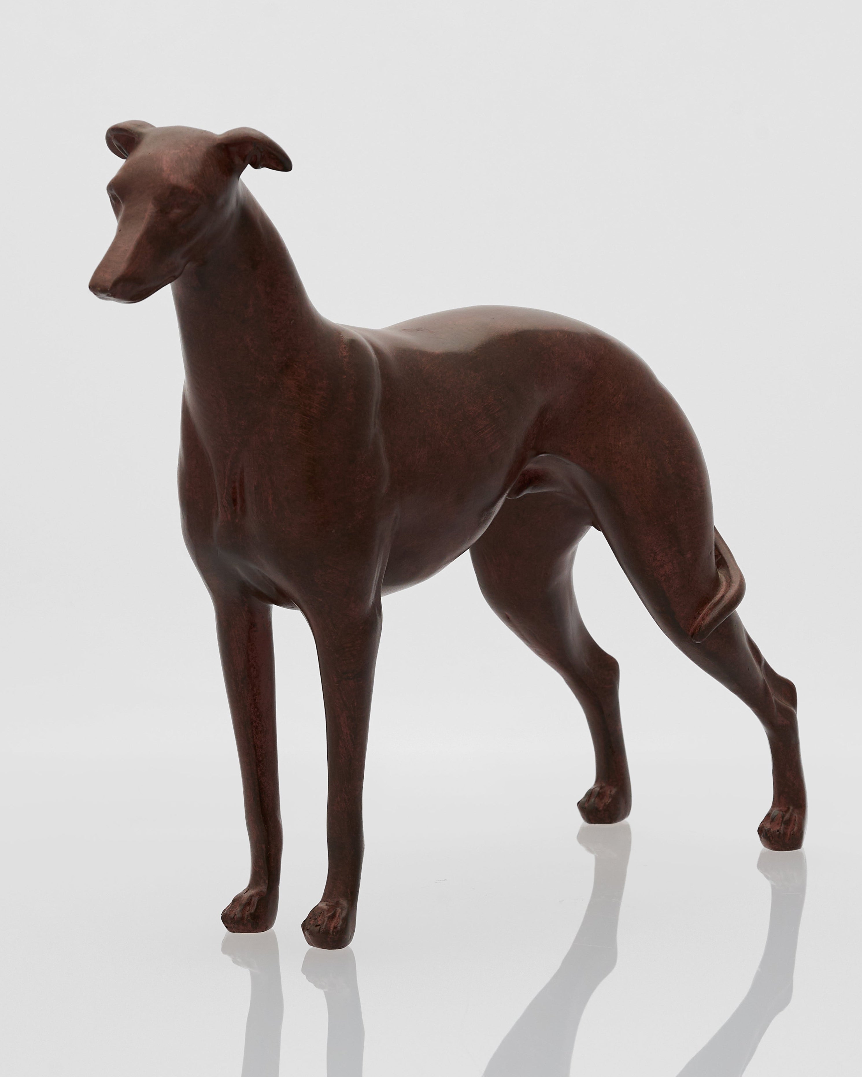 Brown dog figurine on a white background