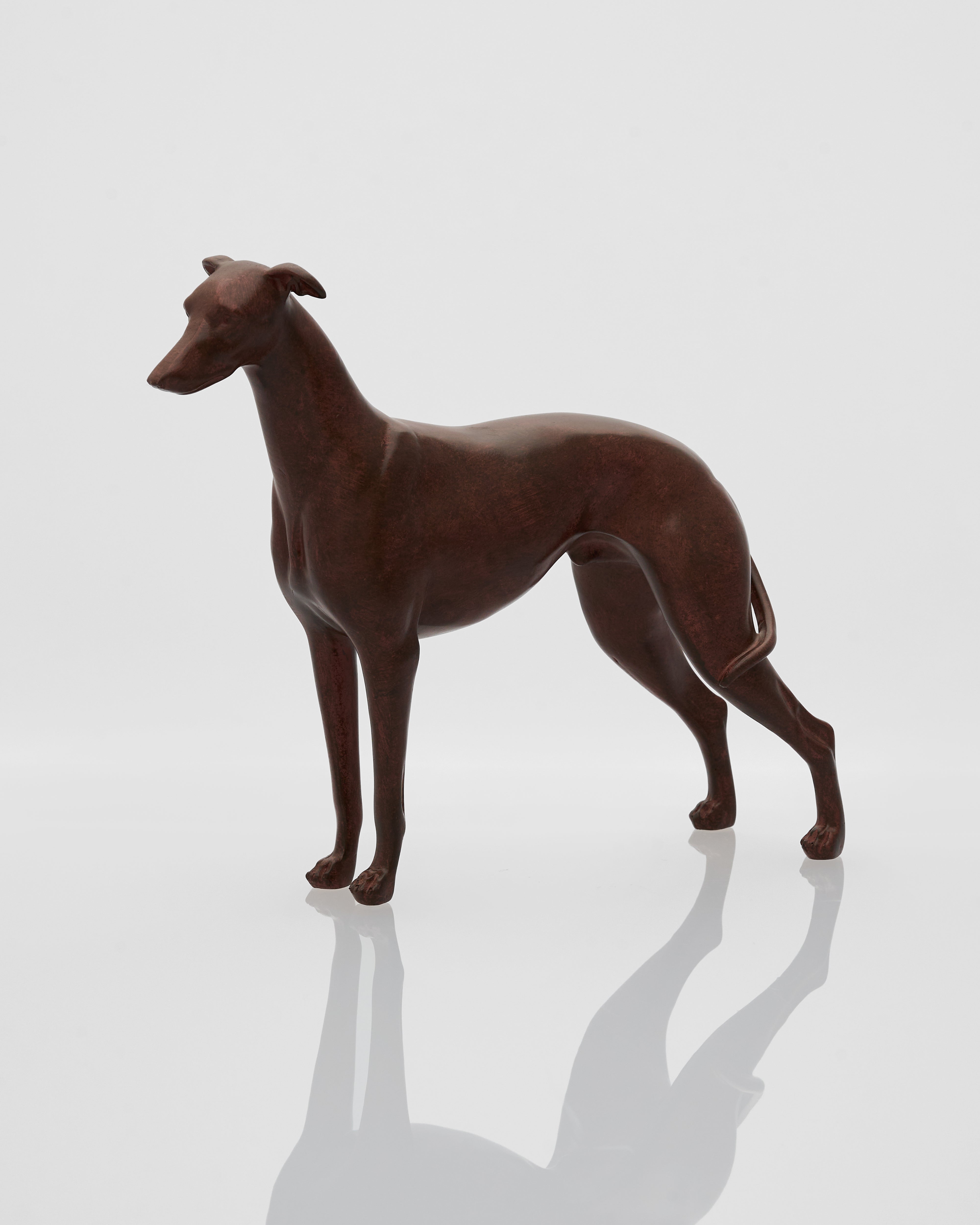 Brown wooden dog figurine on a white background