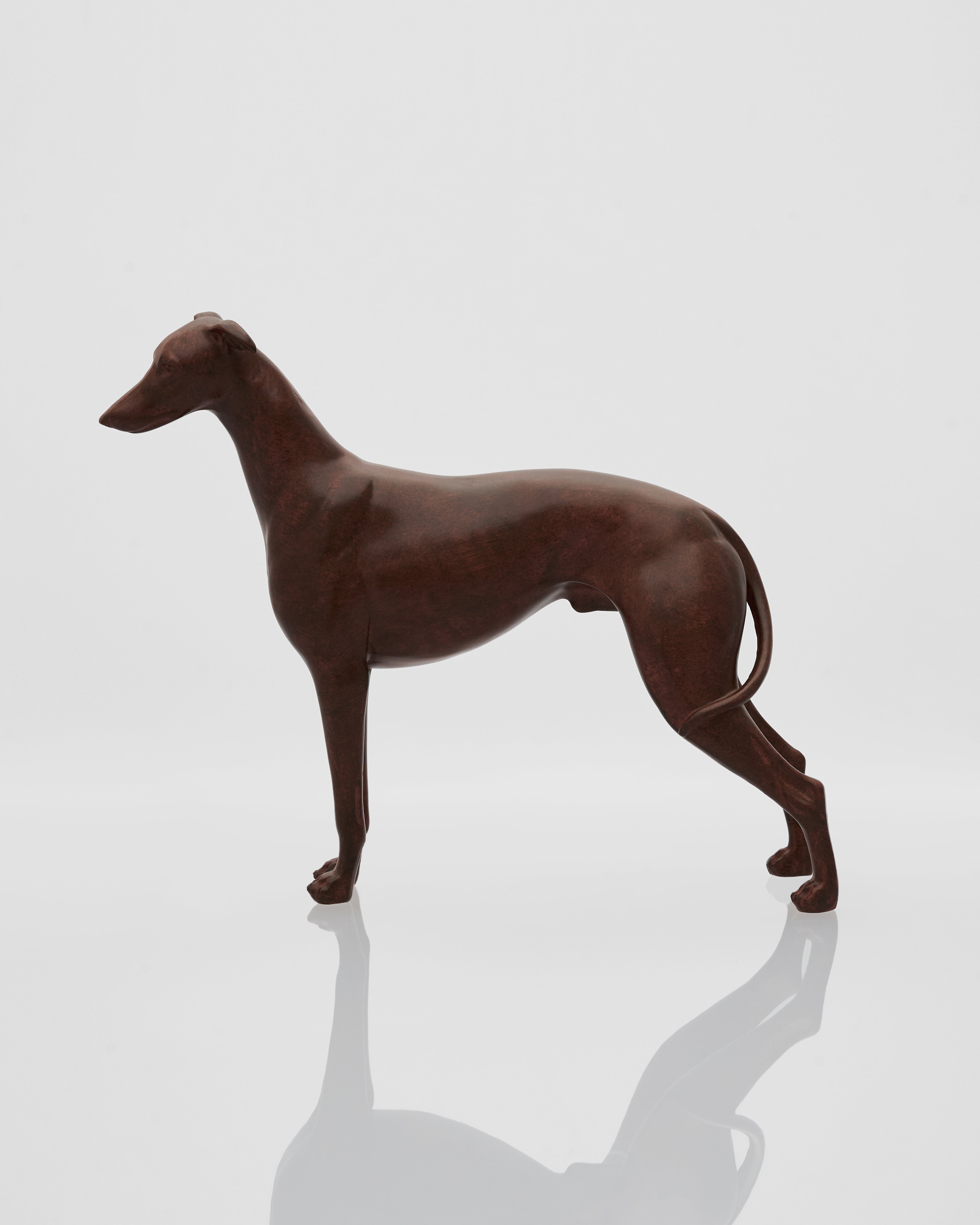 wooden sculpture of a dog on a reflective surface with a light gray background