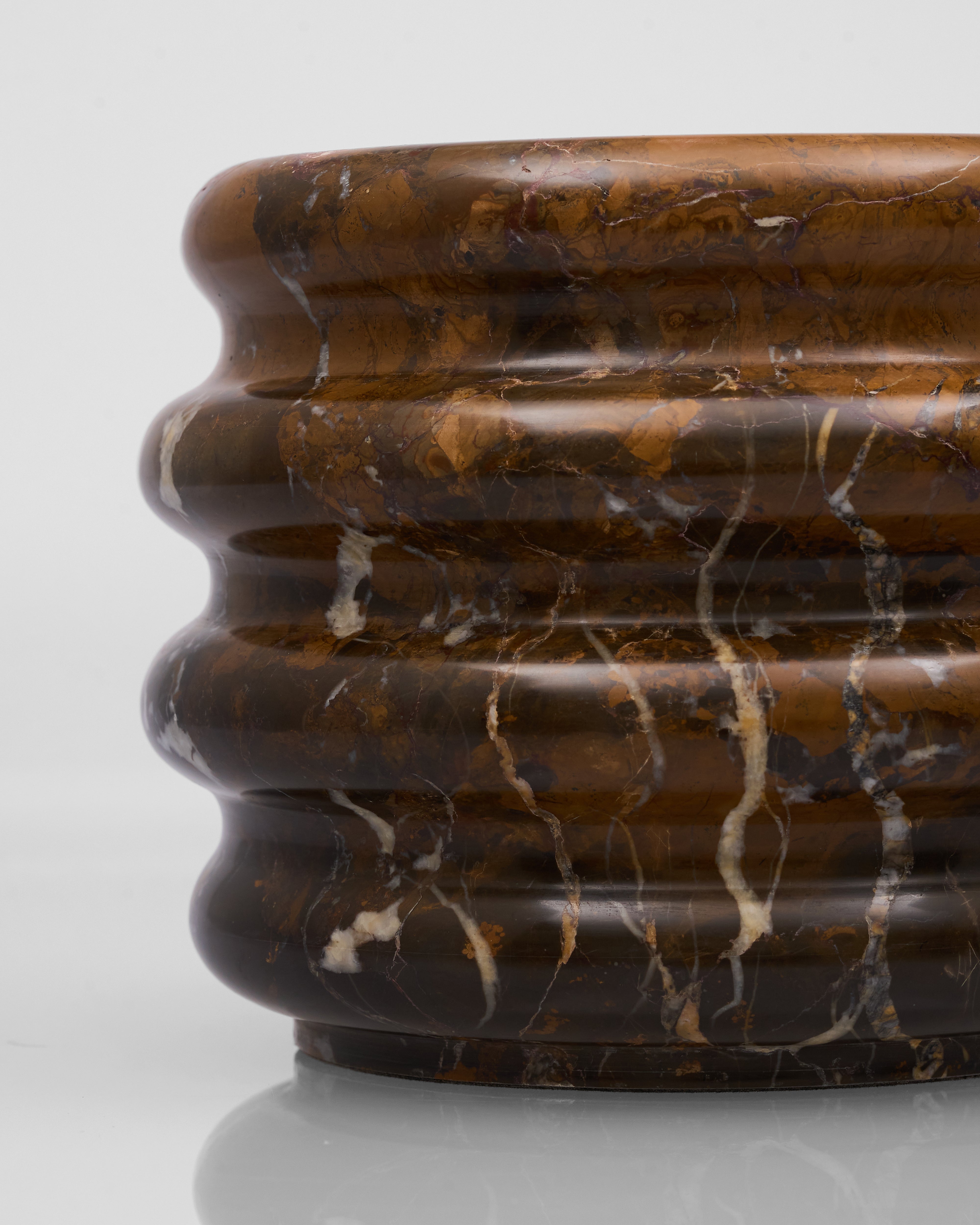 Marble-patterned brown vase on a white background