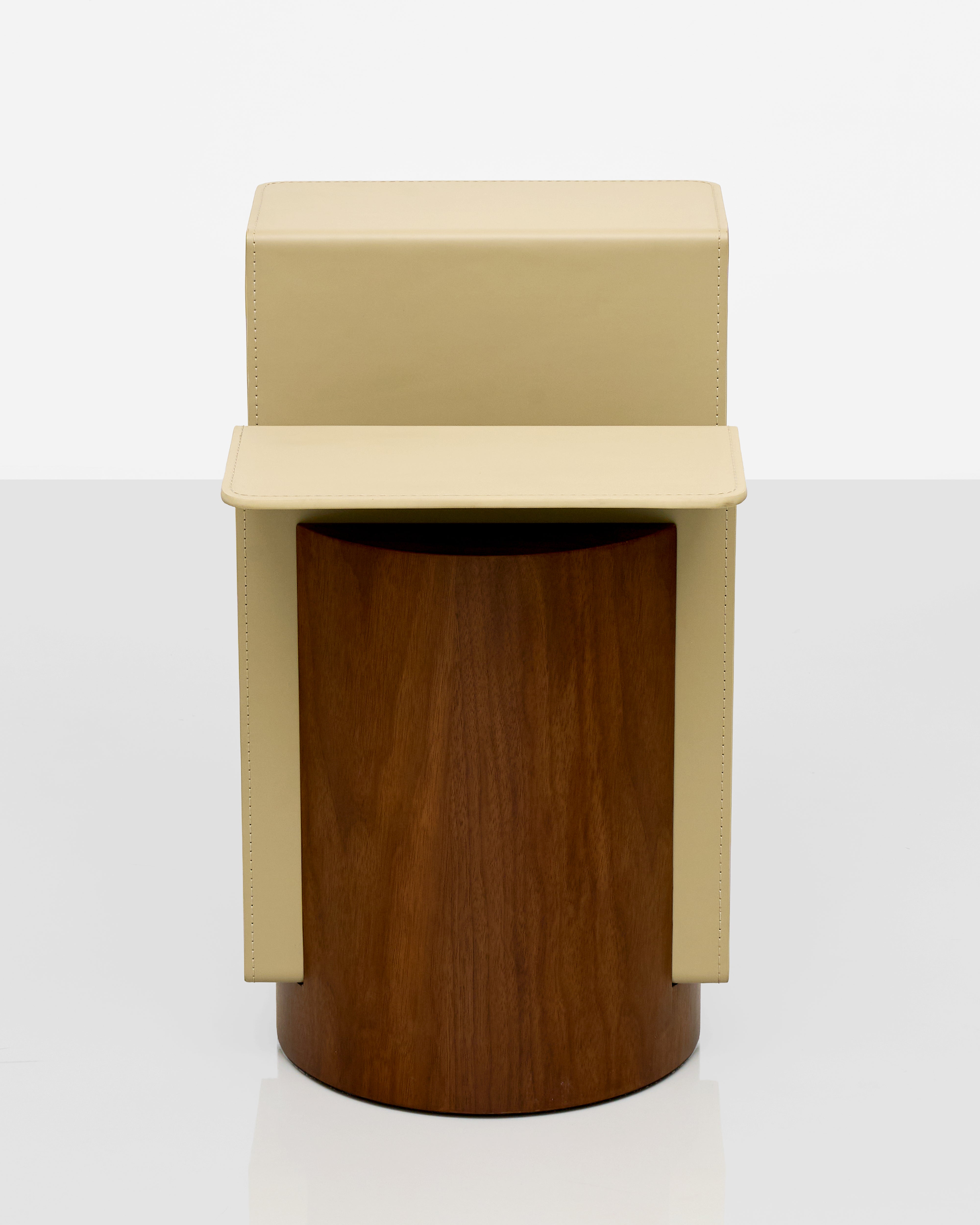 Two-toned cylindrical stool with beige top and brown bottom on a white background