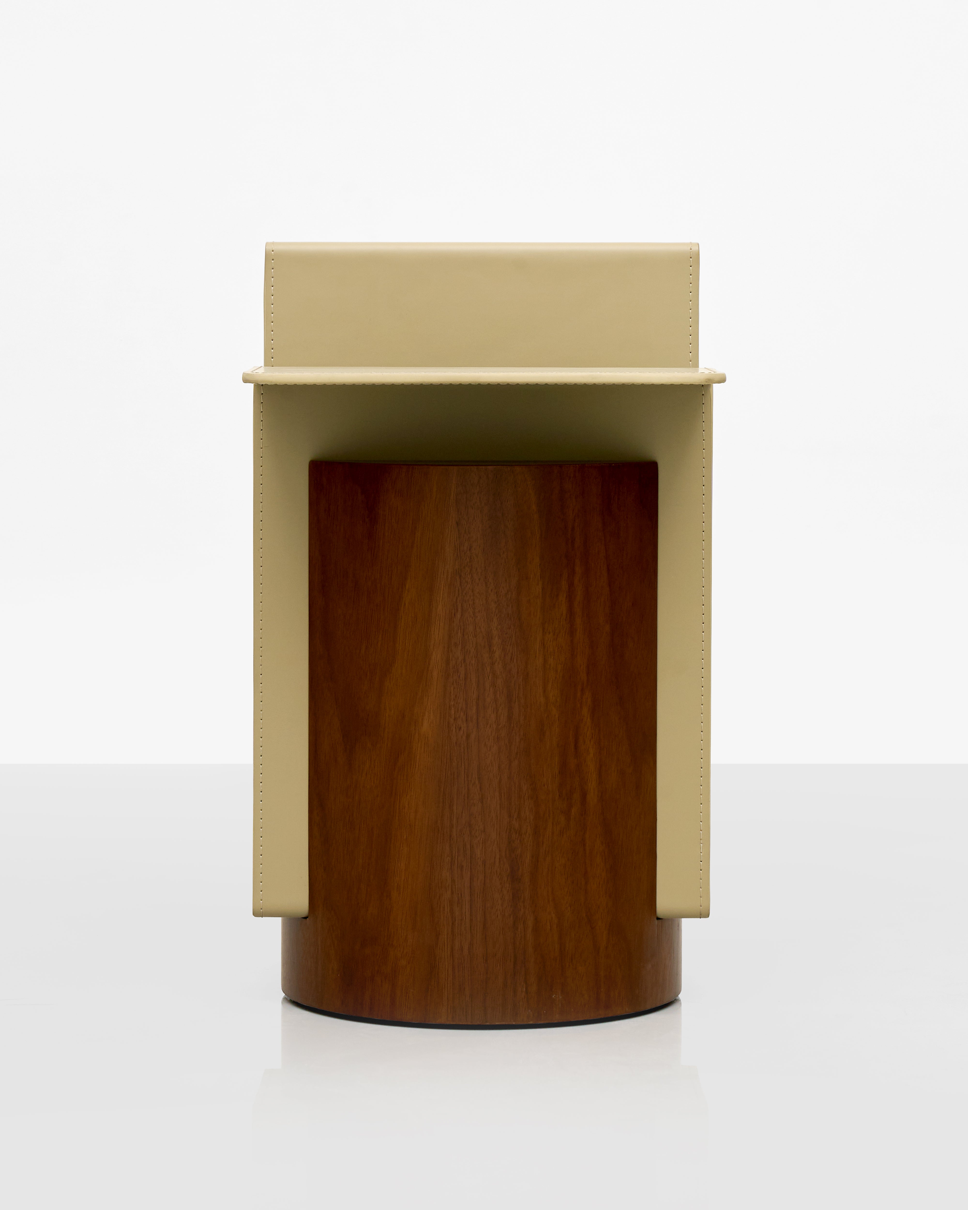 Two-toned cylindrical object with beige top and brown bottom on a white background