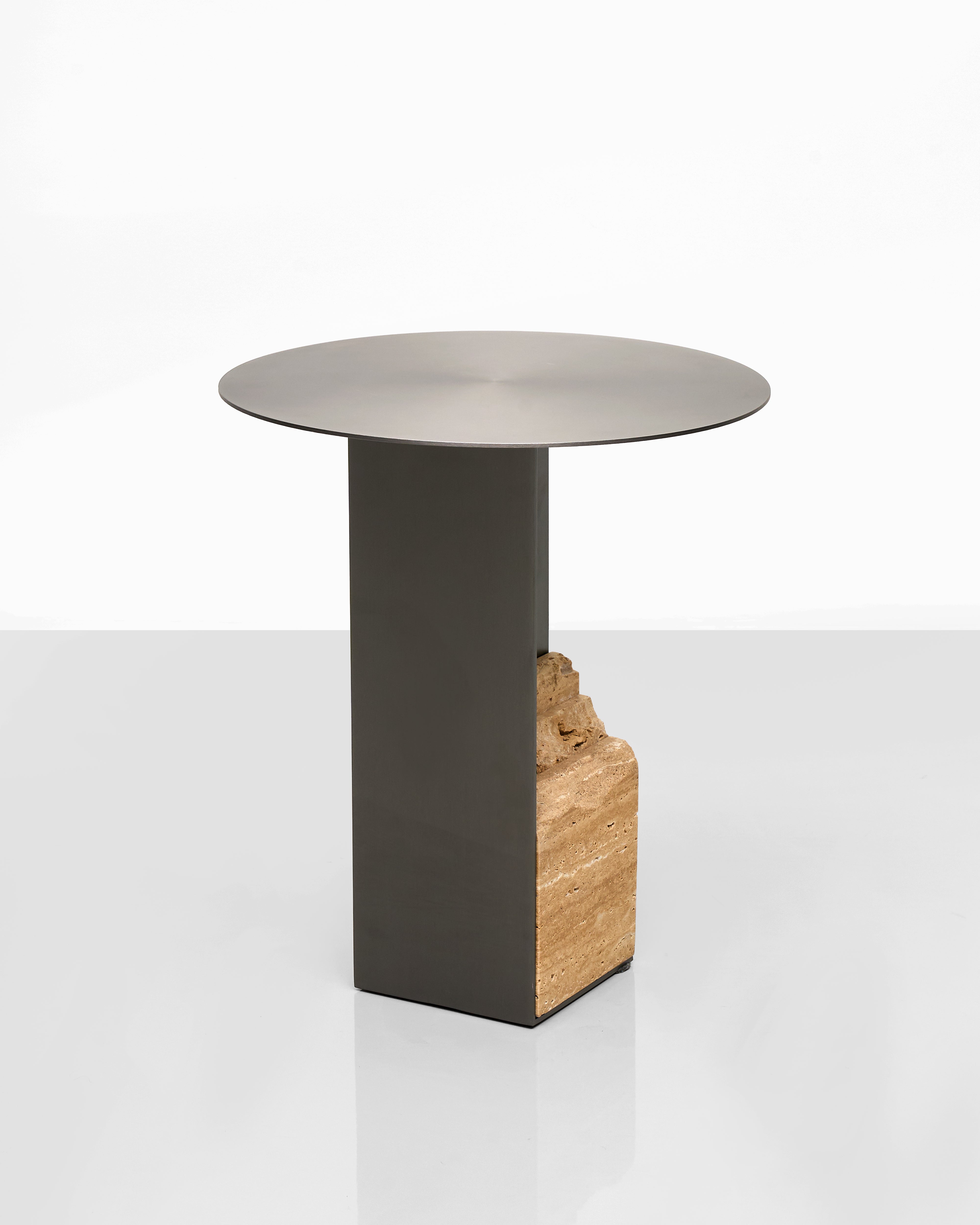 Modern side table with a metallic finish and marble base on a white background