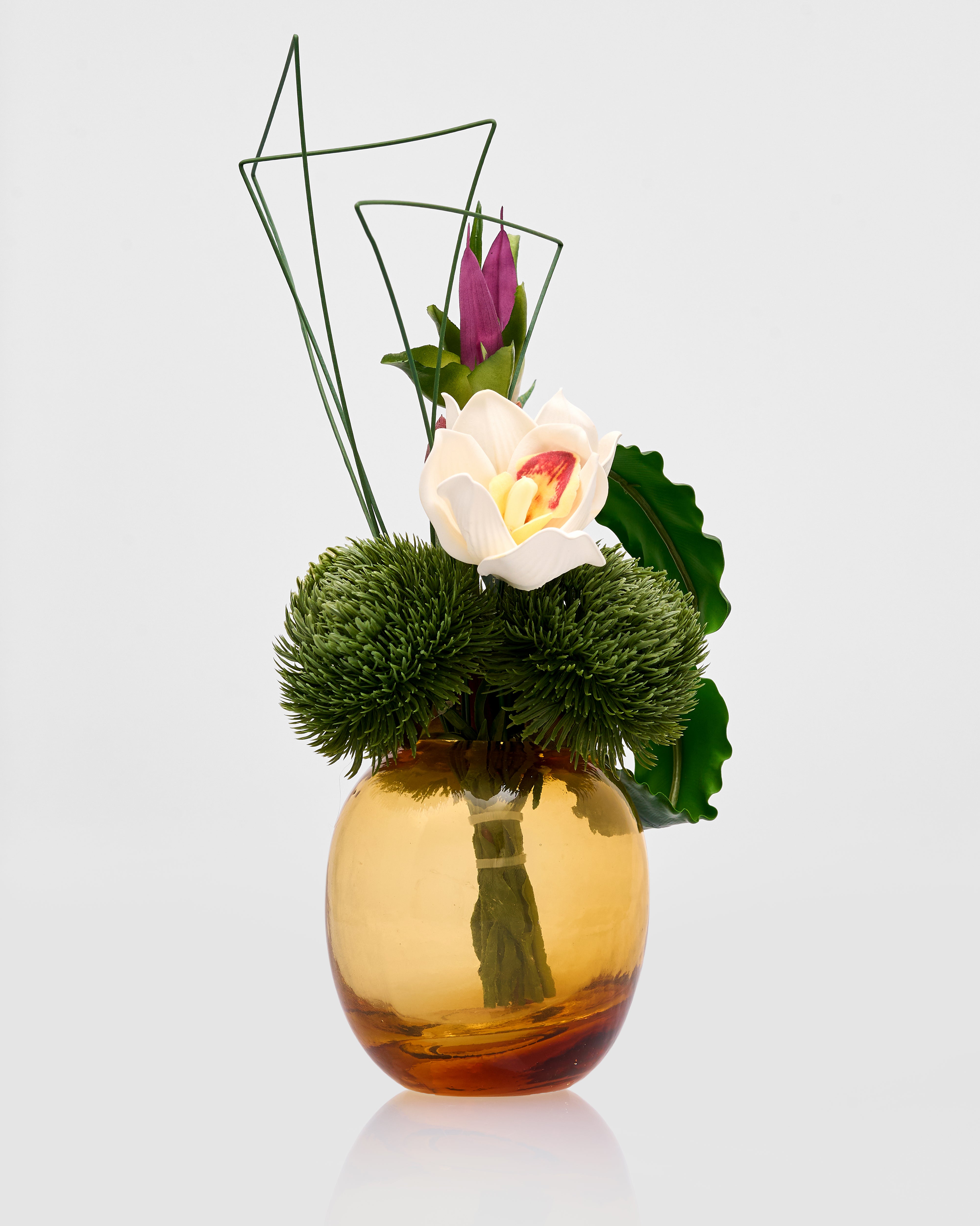 Gold vase with flowers on a white background