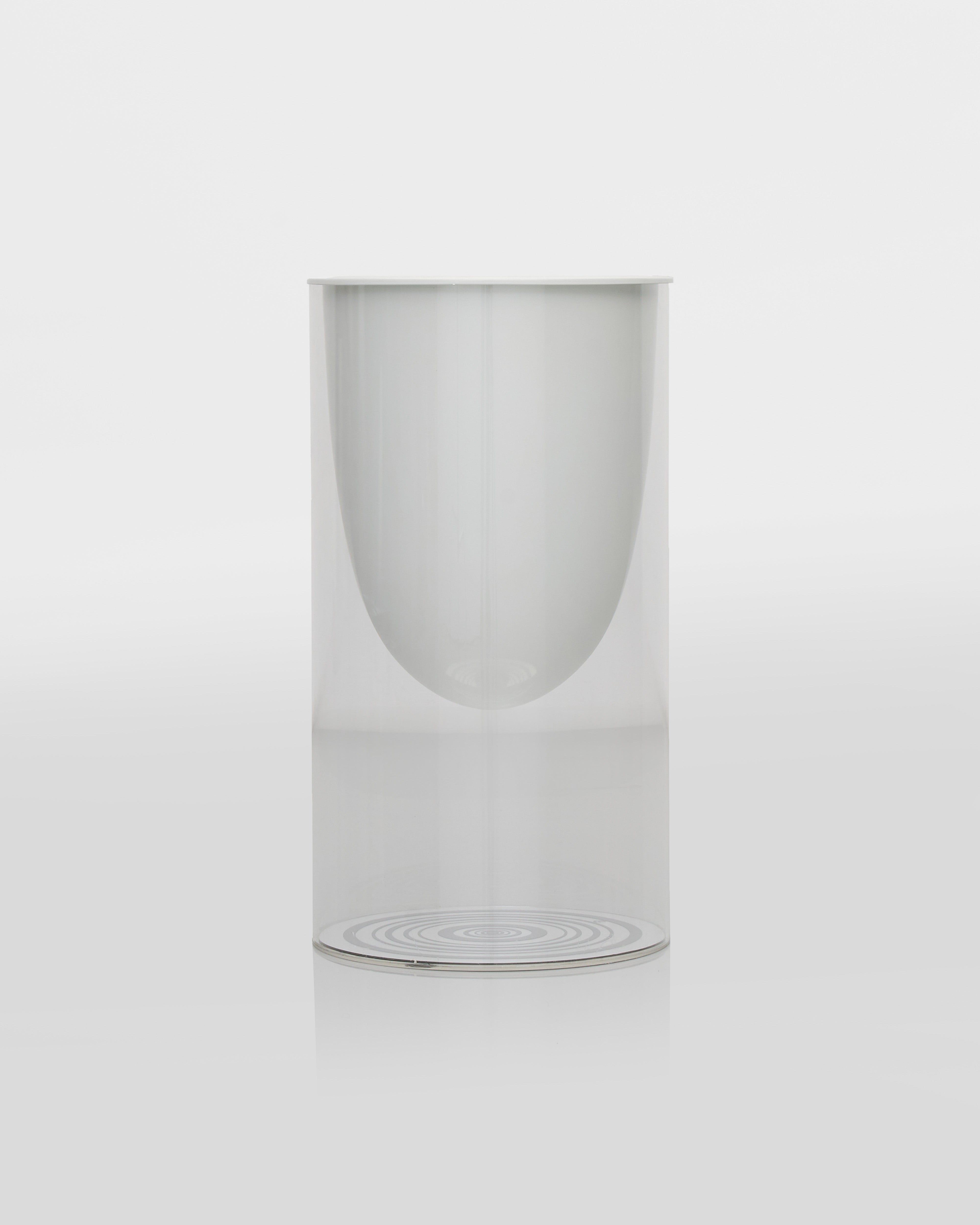 Clear planter white vase and transparent vase cover on a white background