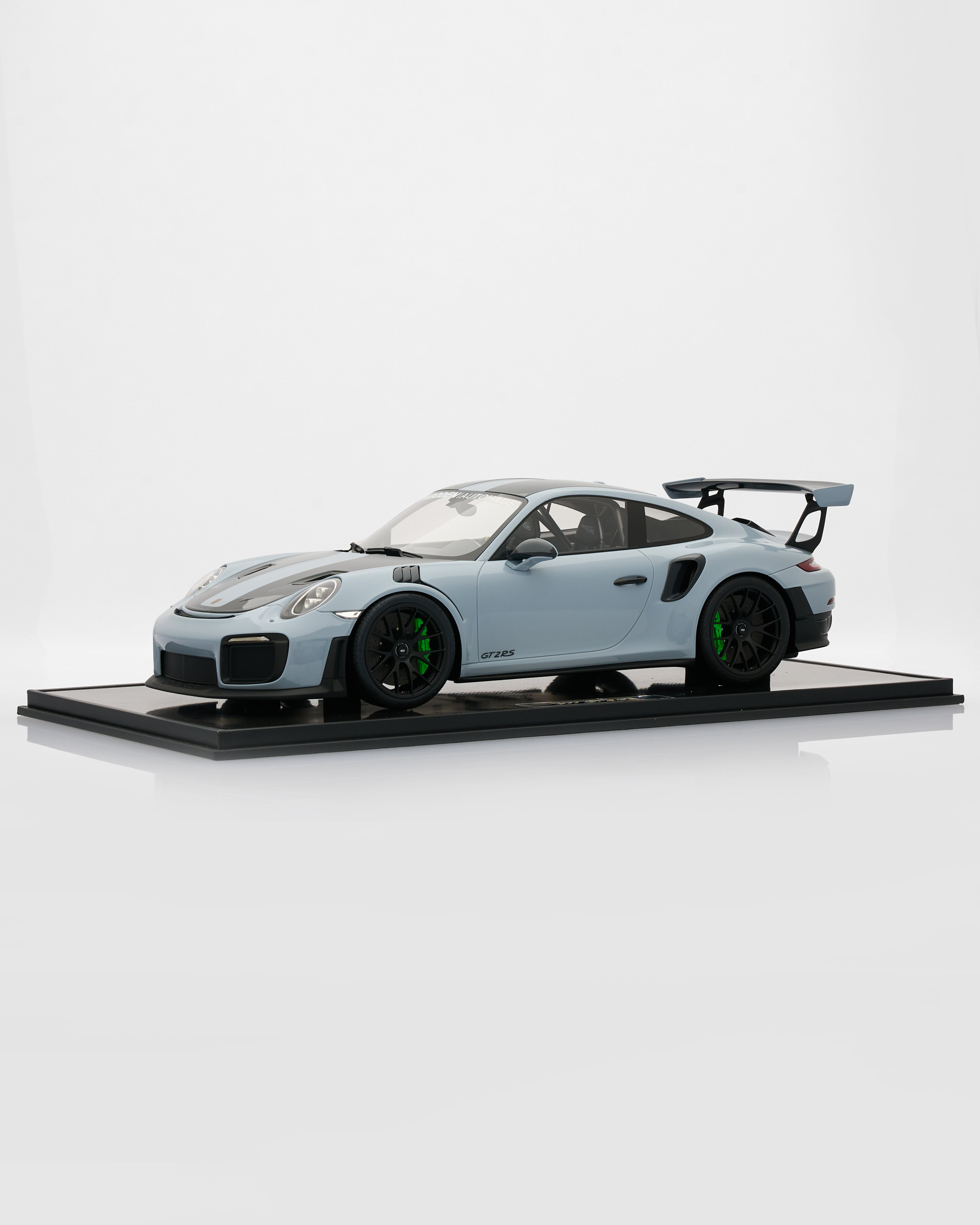 Model car on a display stand with a white background