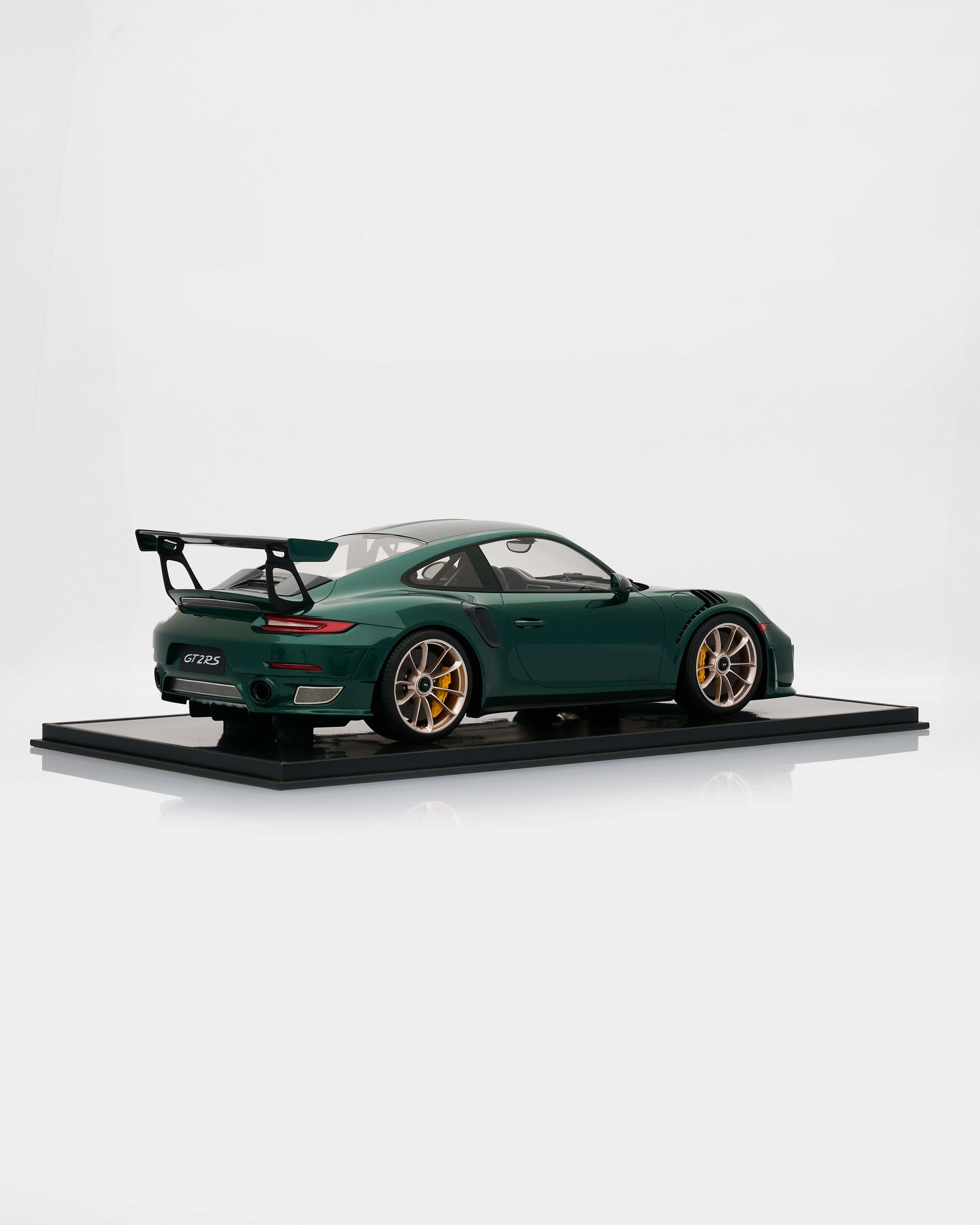 Model of a green sports car on a white background