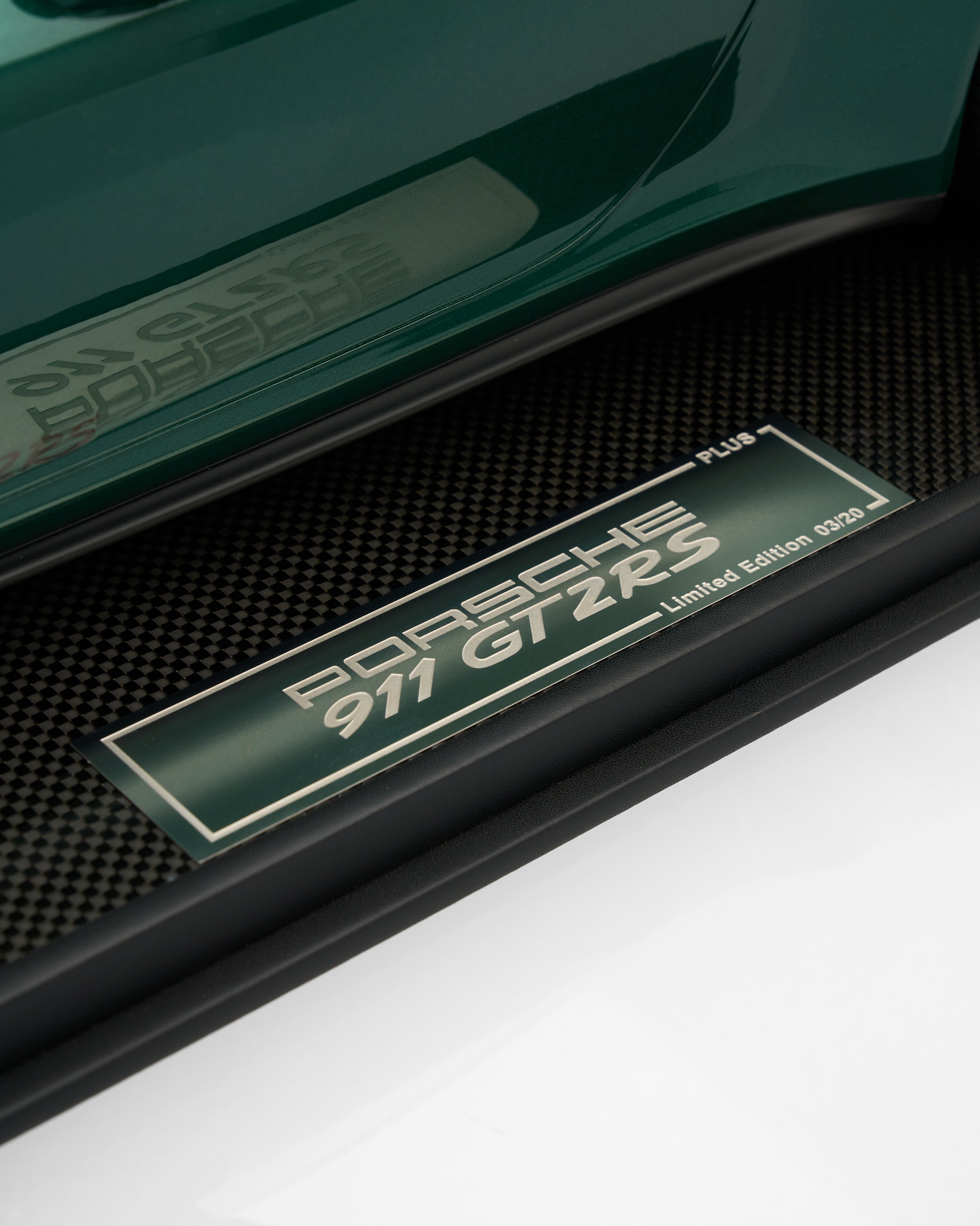 Porsche 911 GT2 RS badge on a car door