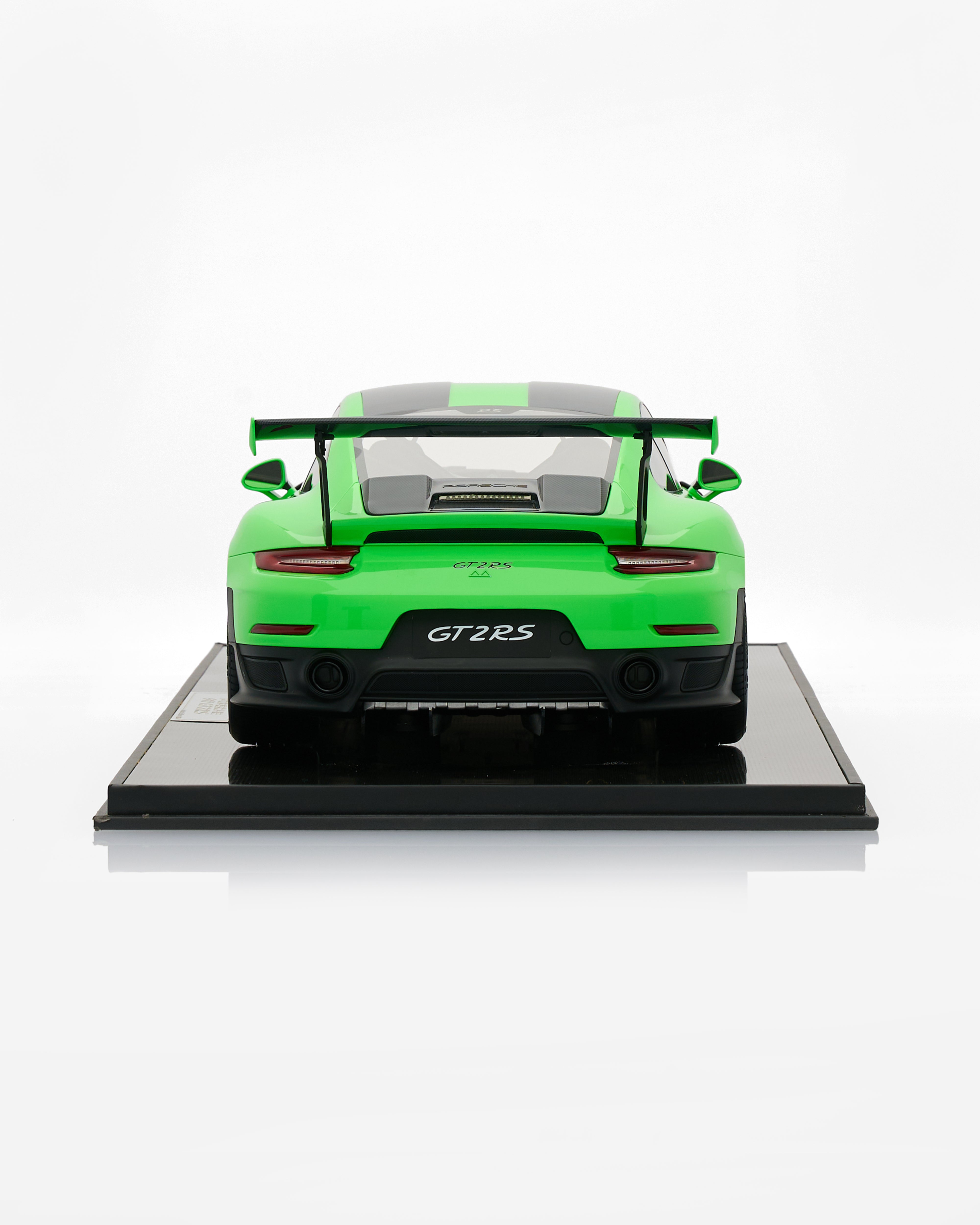 Porsche 911 GT2RS Viper Green model car on a black platform with a white background
