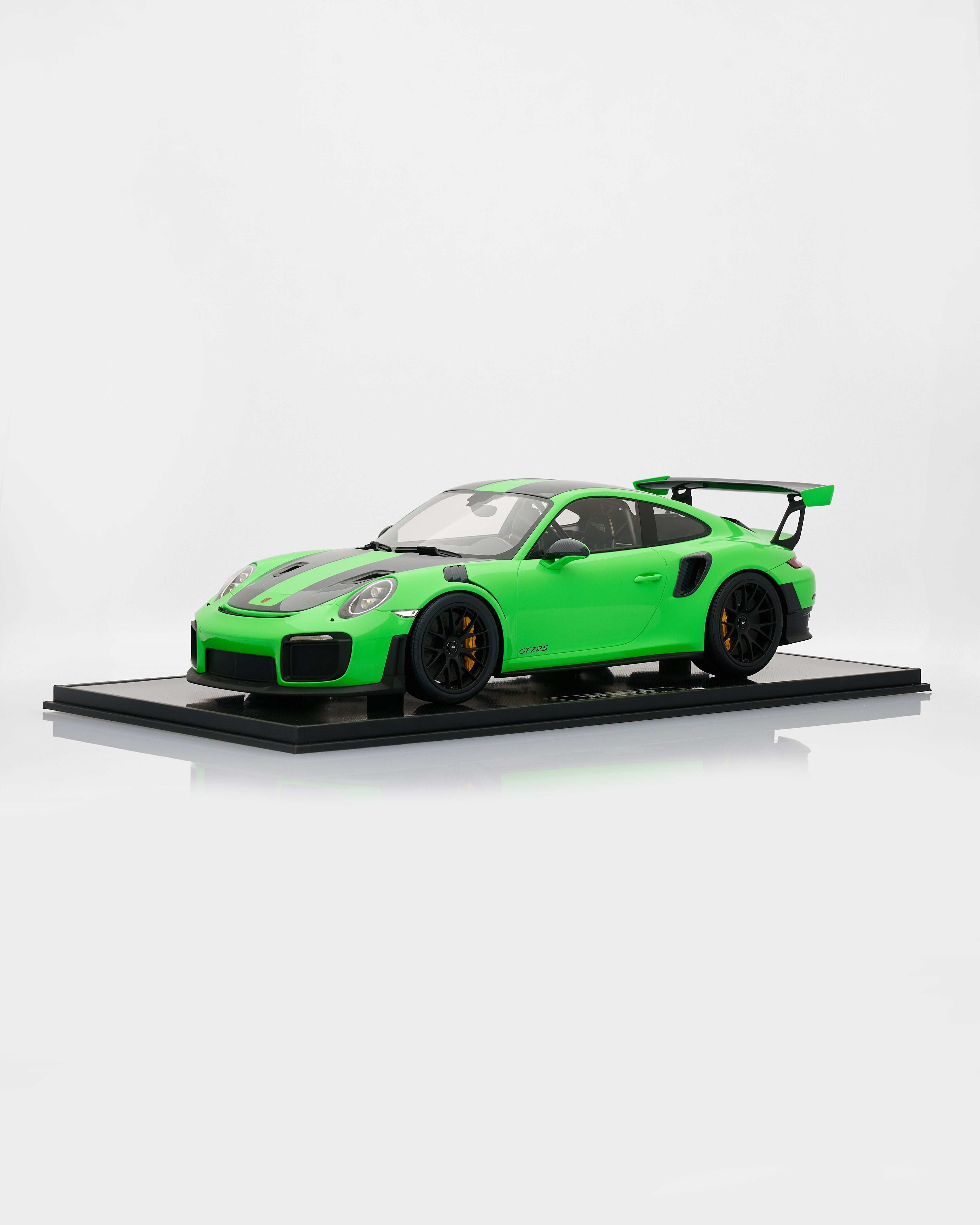 Green sports car model on a white background