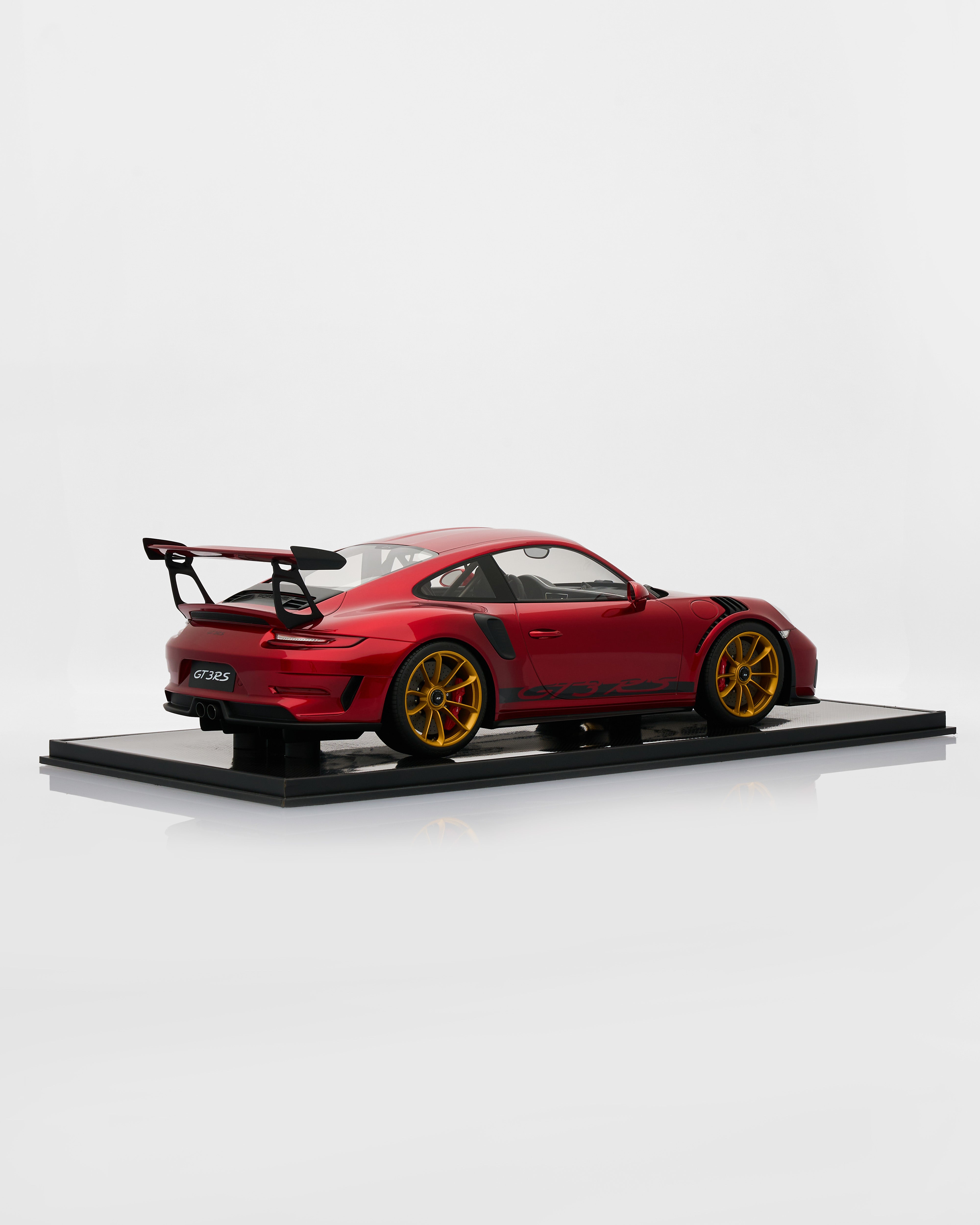 Red sports car model on a white background