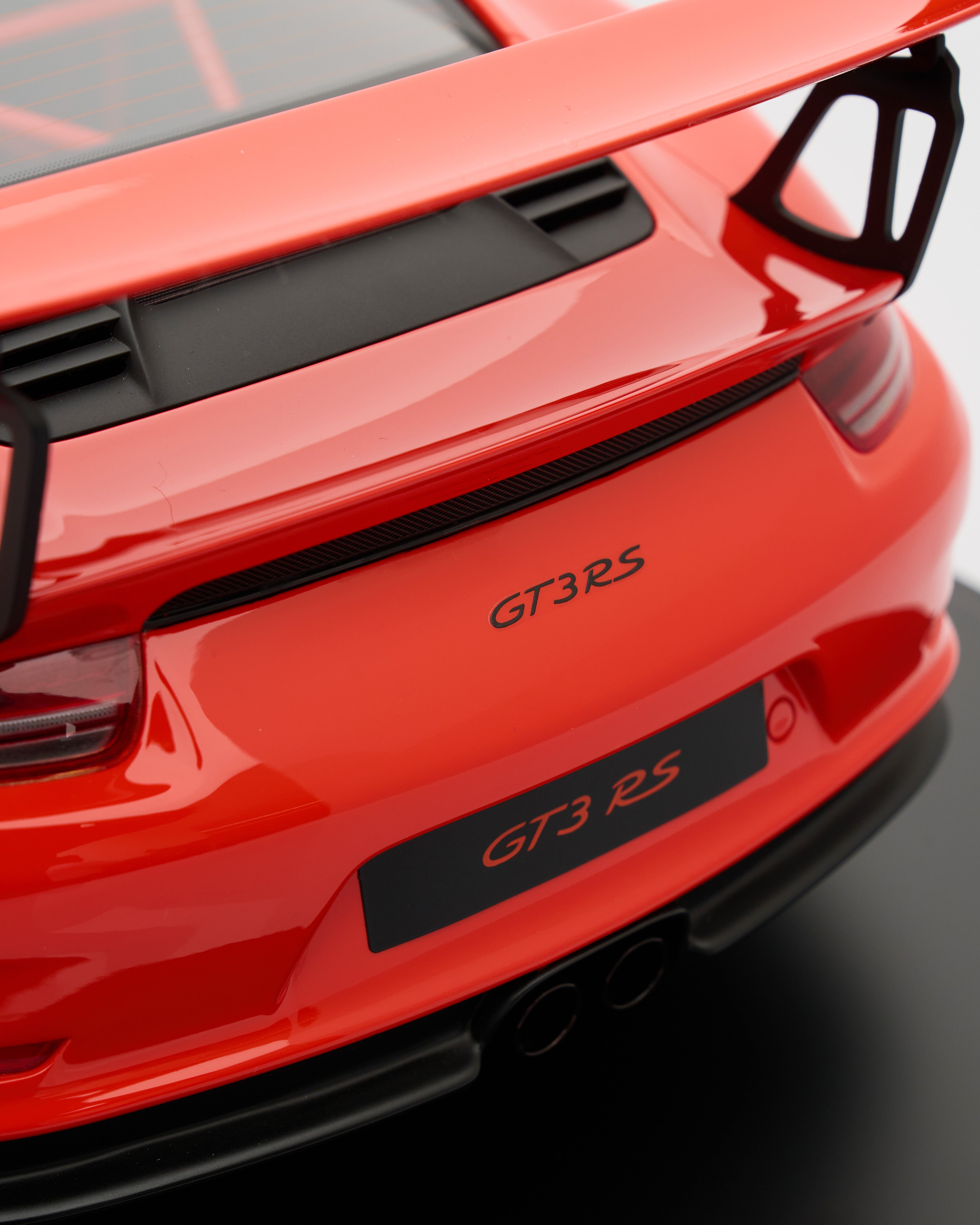 Red GT3 RS car rear with 'GT3 RS' branding on a dark background