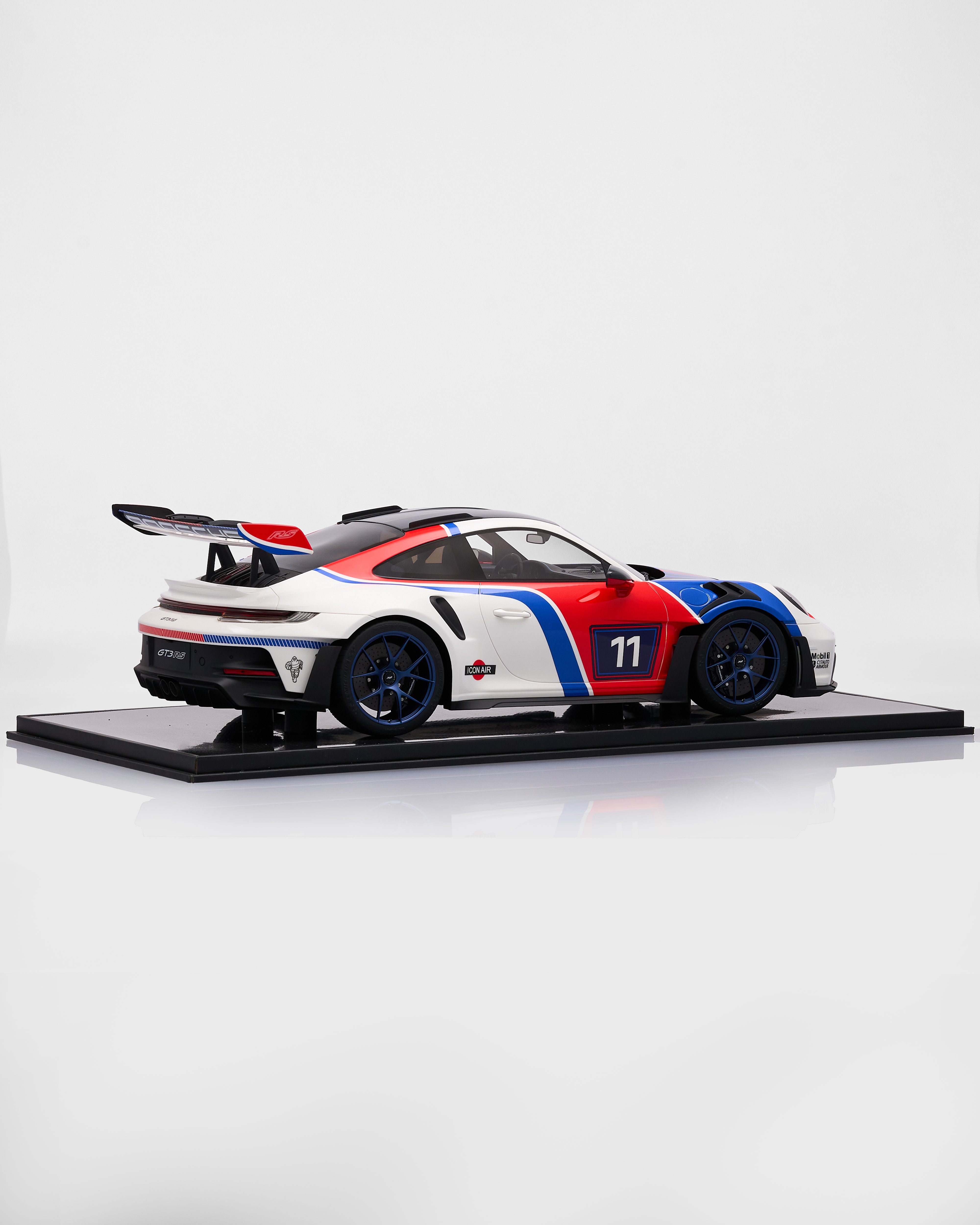 Porsche 911 GT3RS R Rennsport car on a display stand with a white background