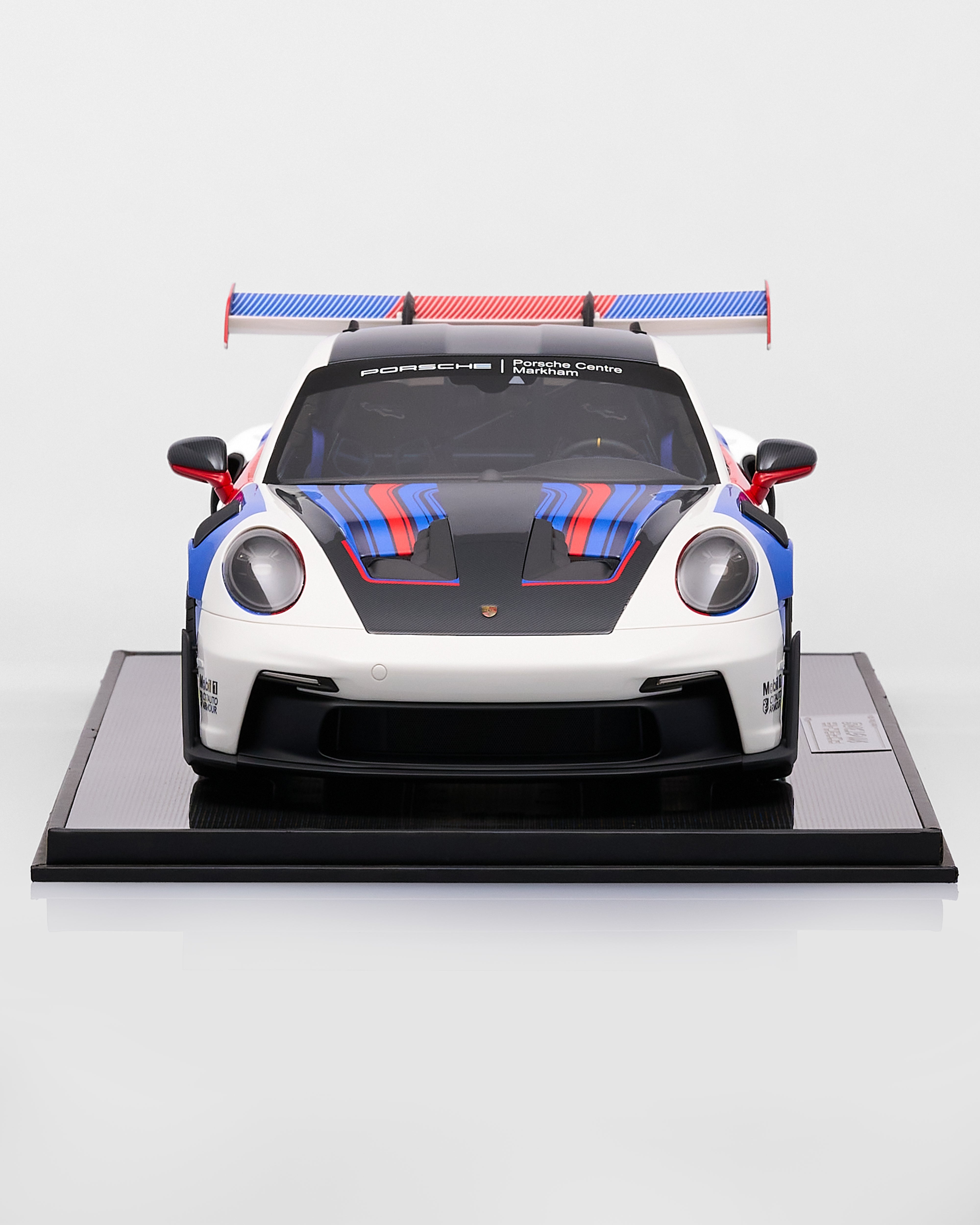 Porsche 911 GT3RS R Rennsport car on a display stand with a white background