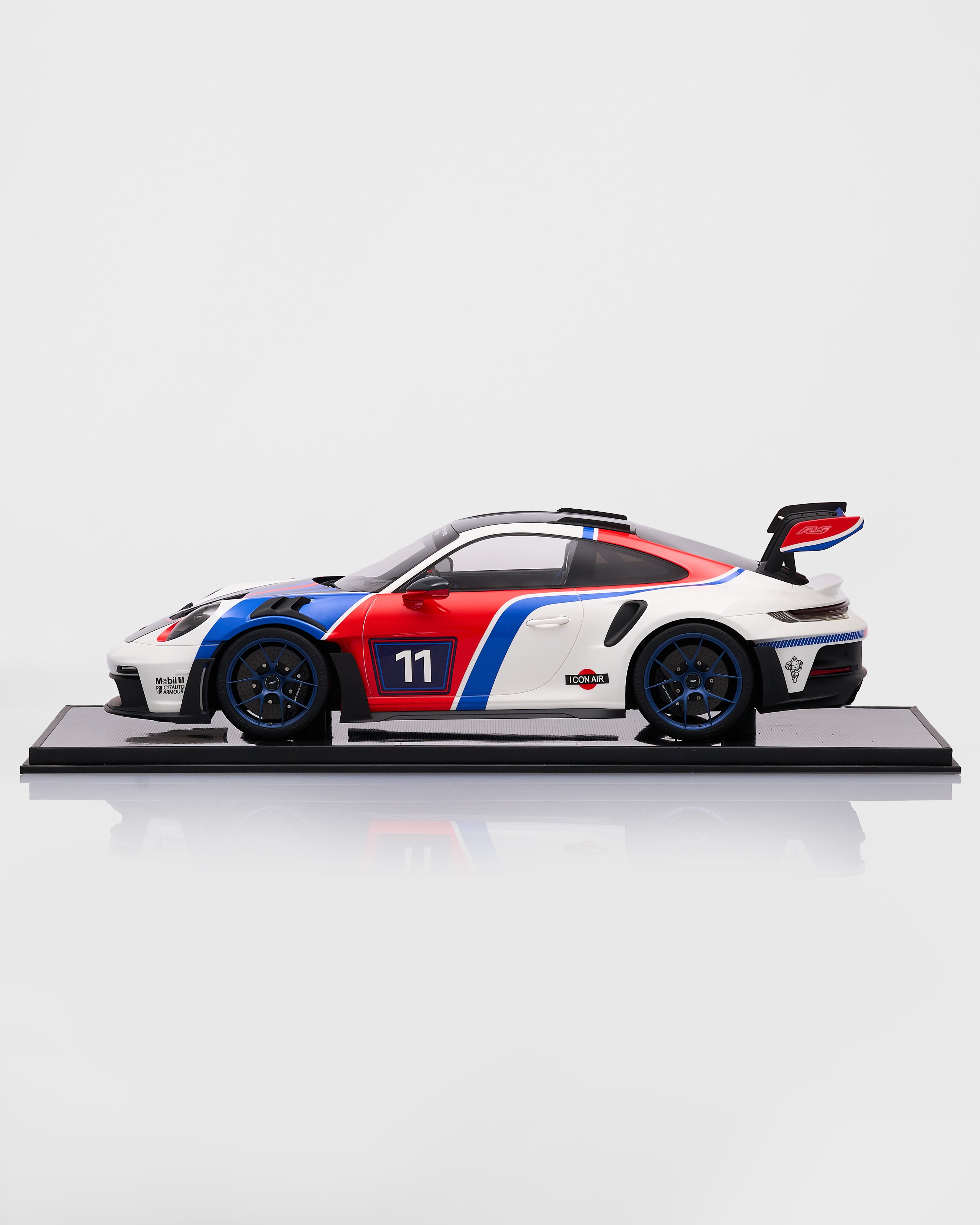Model car of Porsche 911 GT3RS R Rennsport with racing livery on a white background