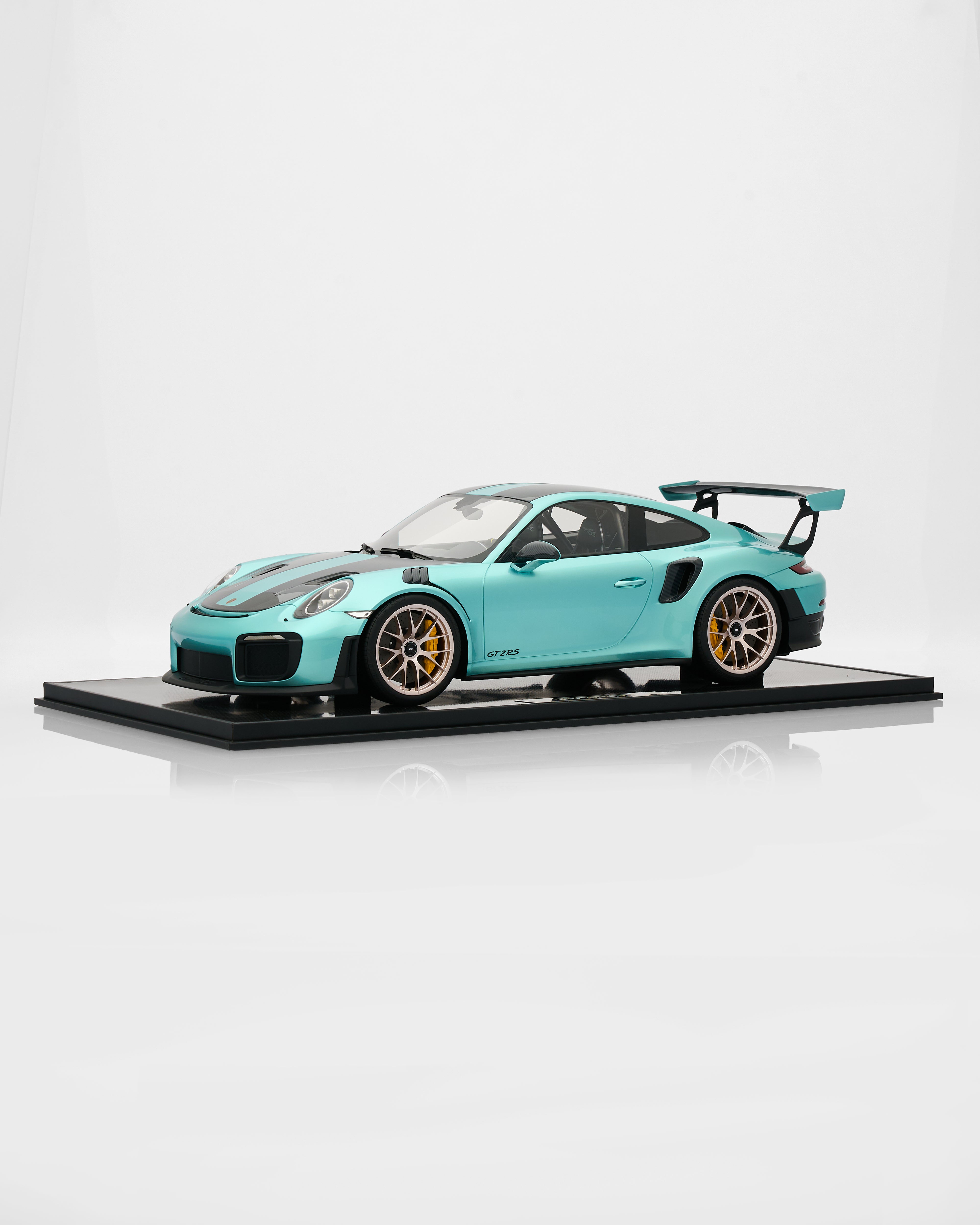 Model of a Porsche GT2RS Mint Green - Limited Edition 19/20 turquoise sports car on a white background