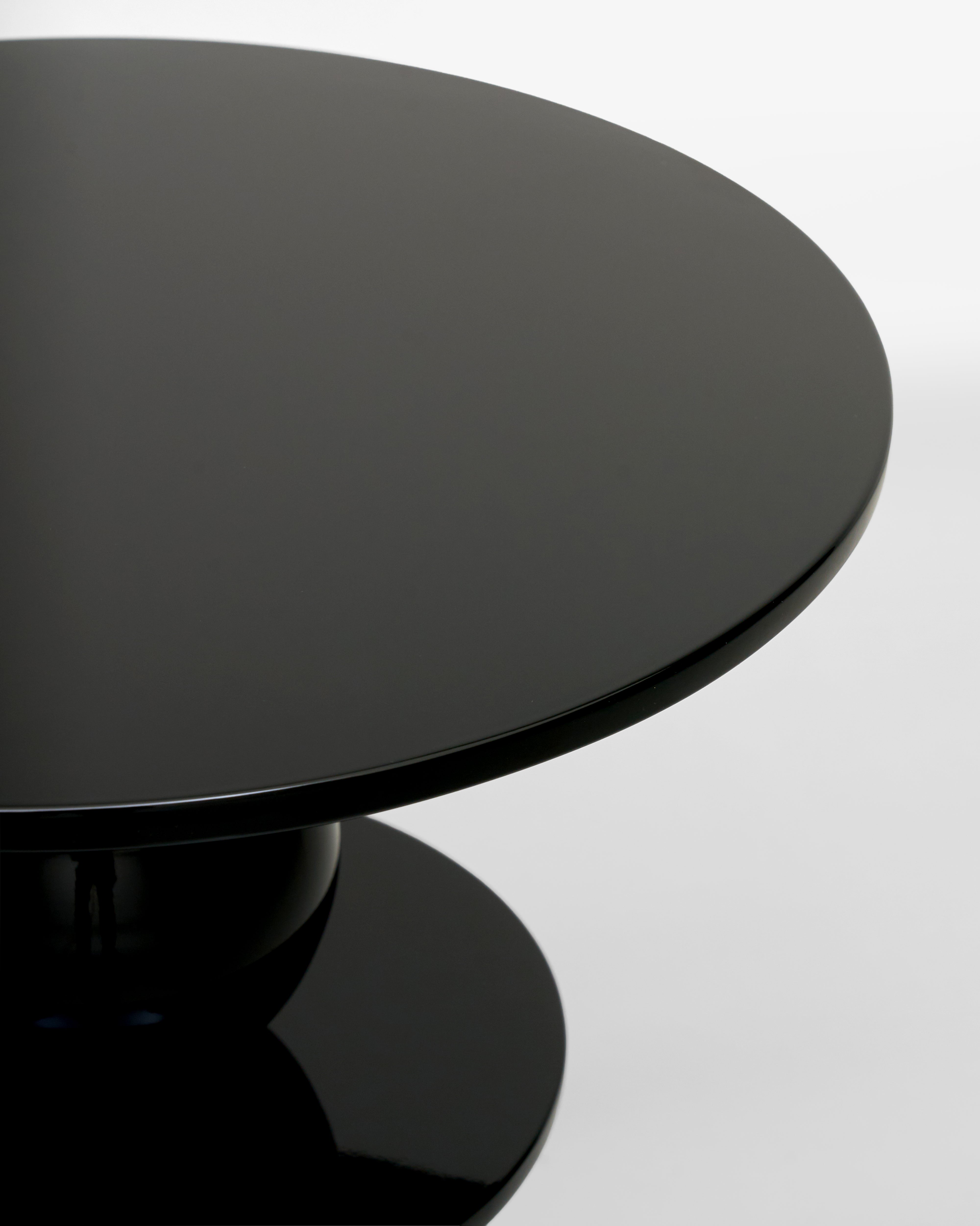 Black round table on a white background