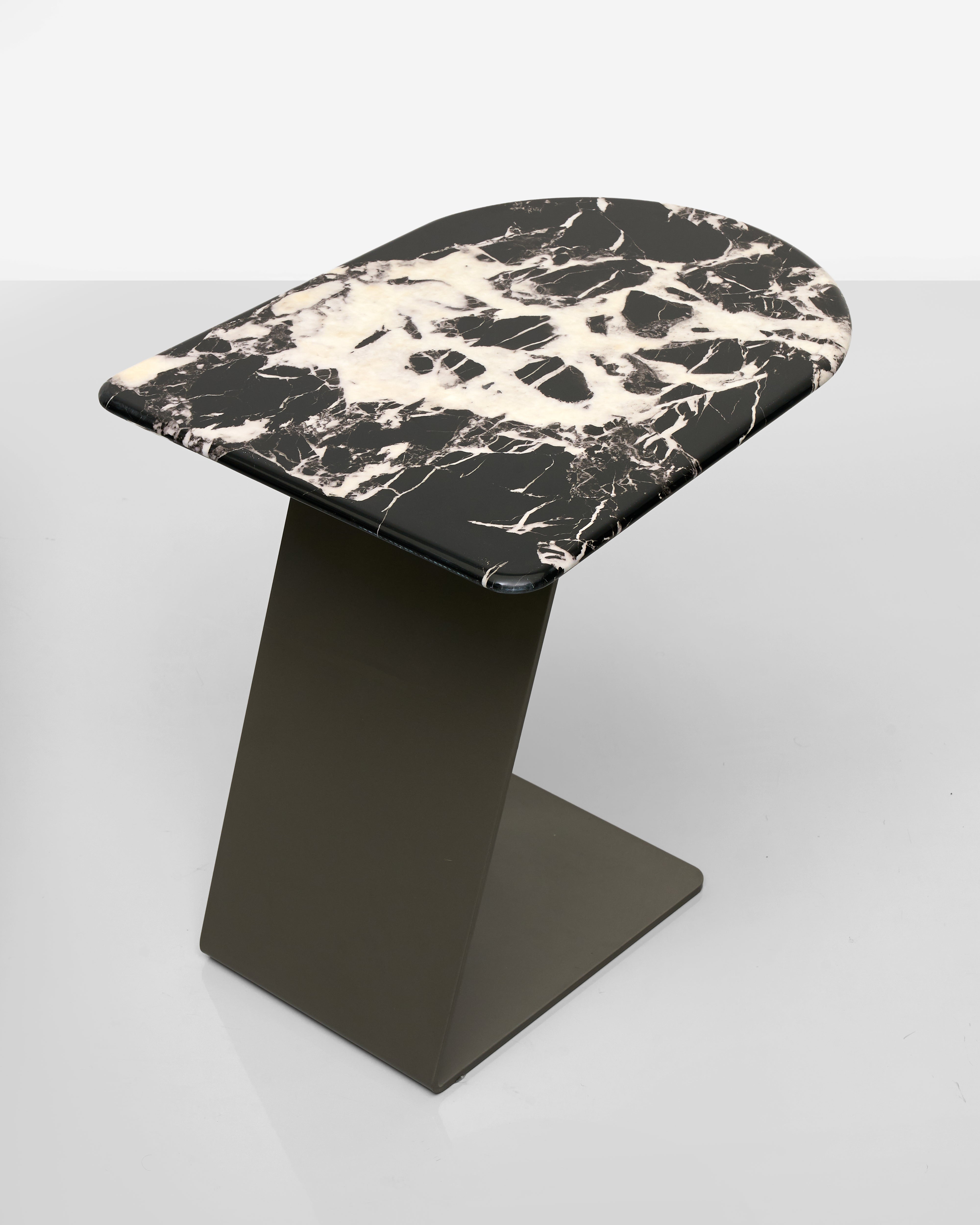 Stool with black and white marble-patterned top on a gray background