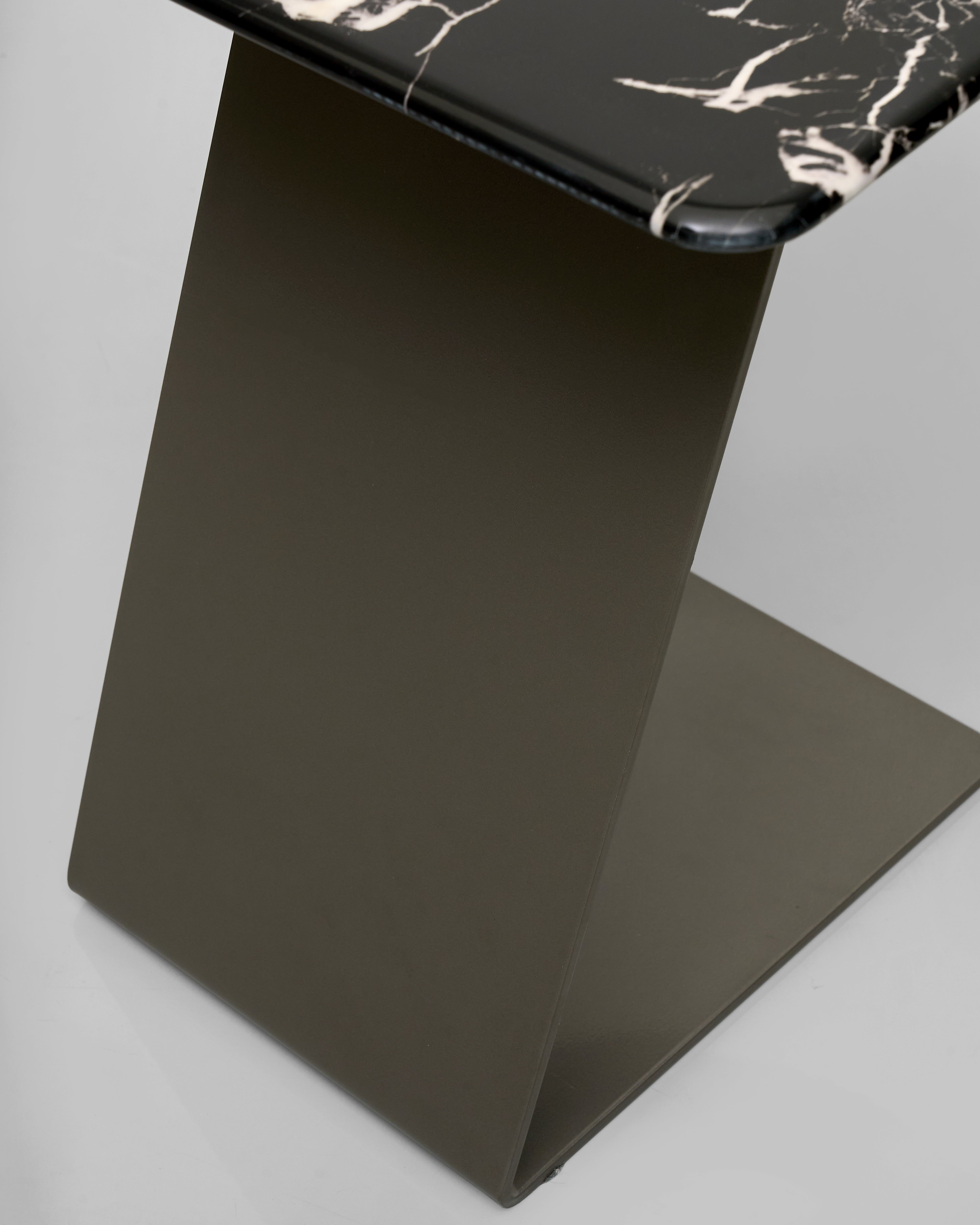 Black marble top table on a gray background