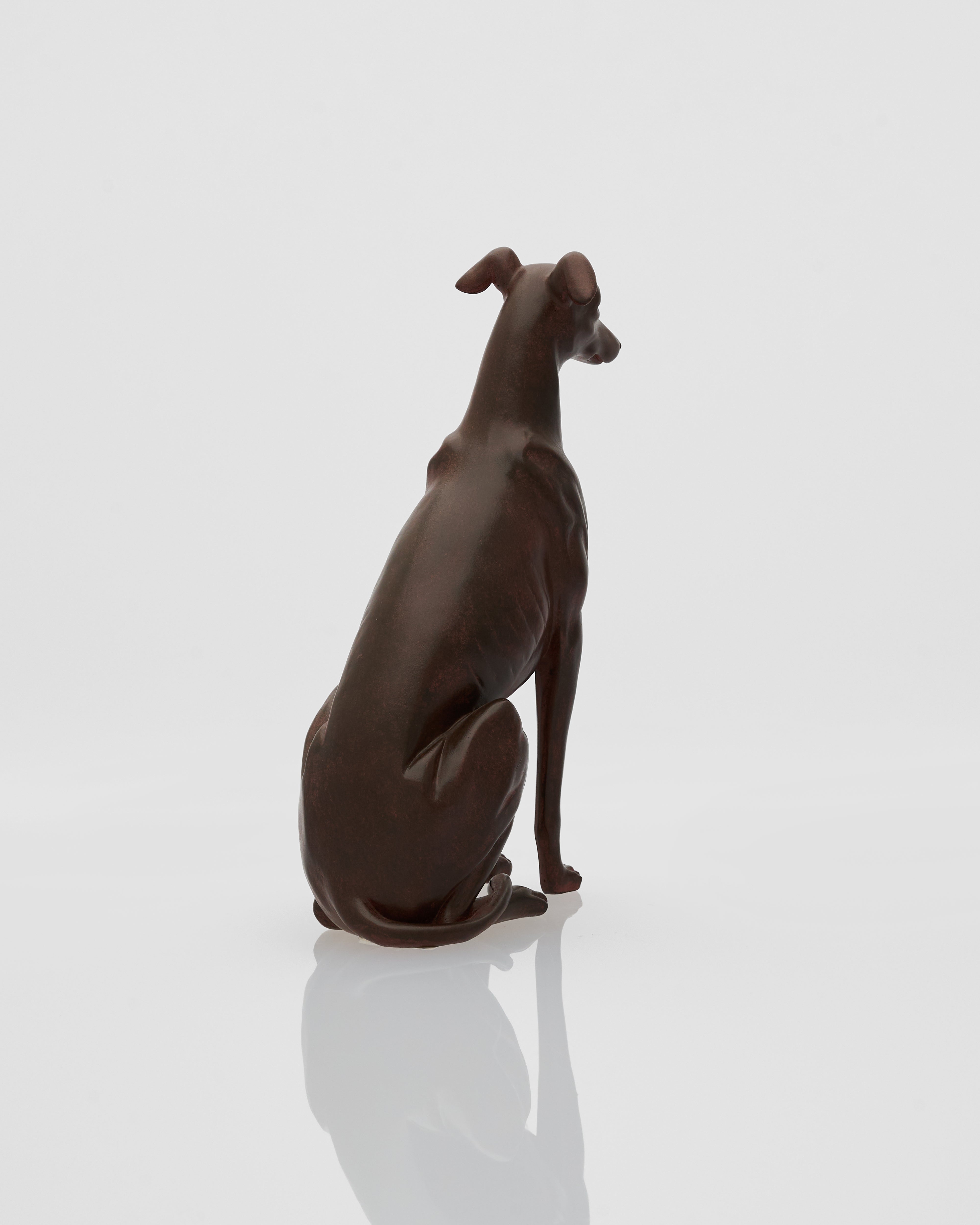 Brown wood dog figurine on a white background