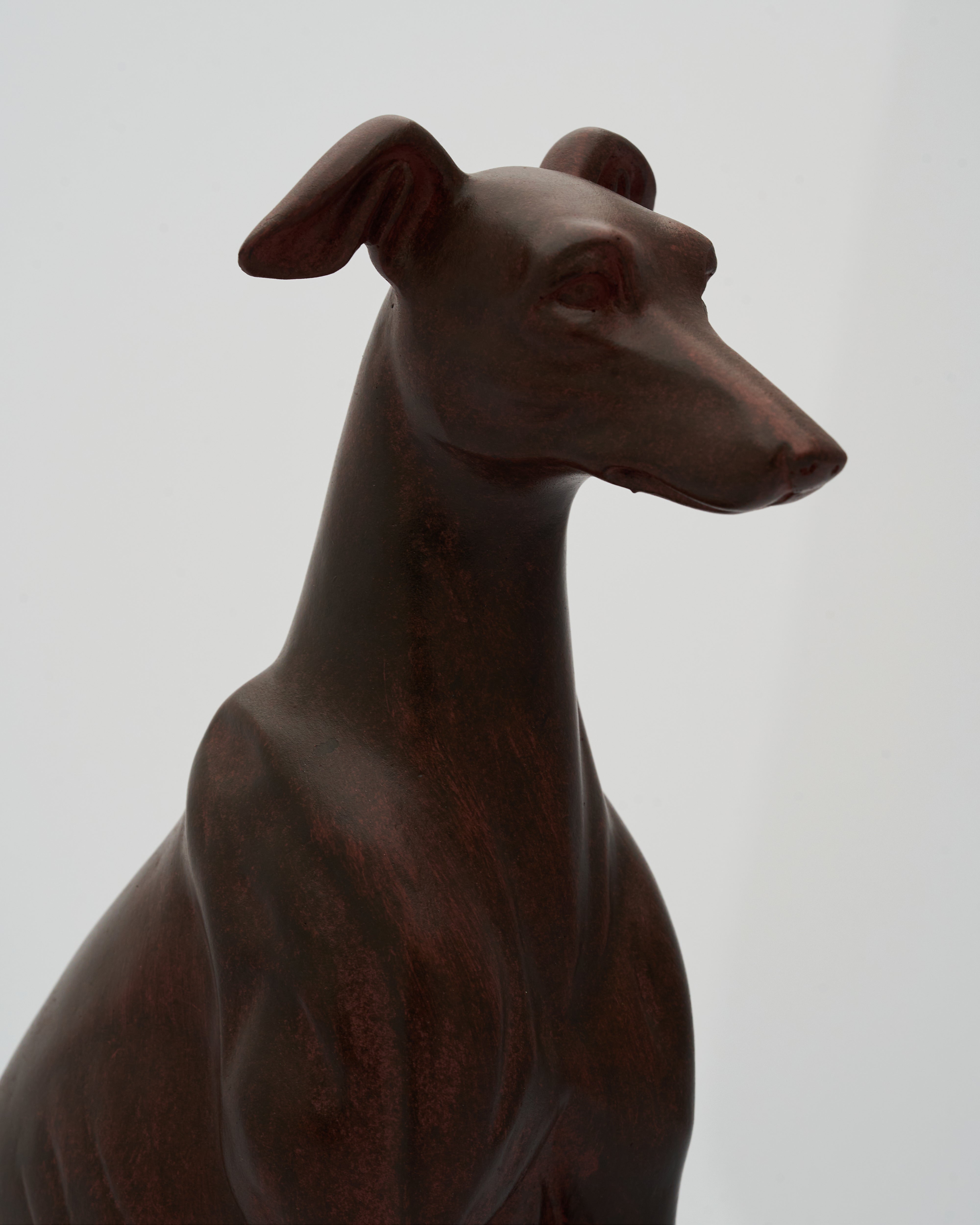 Wooden dog figurine on a plain background