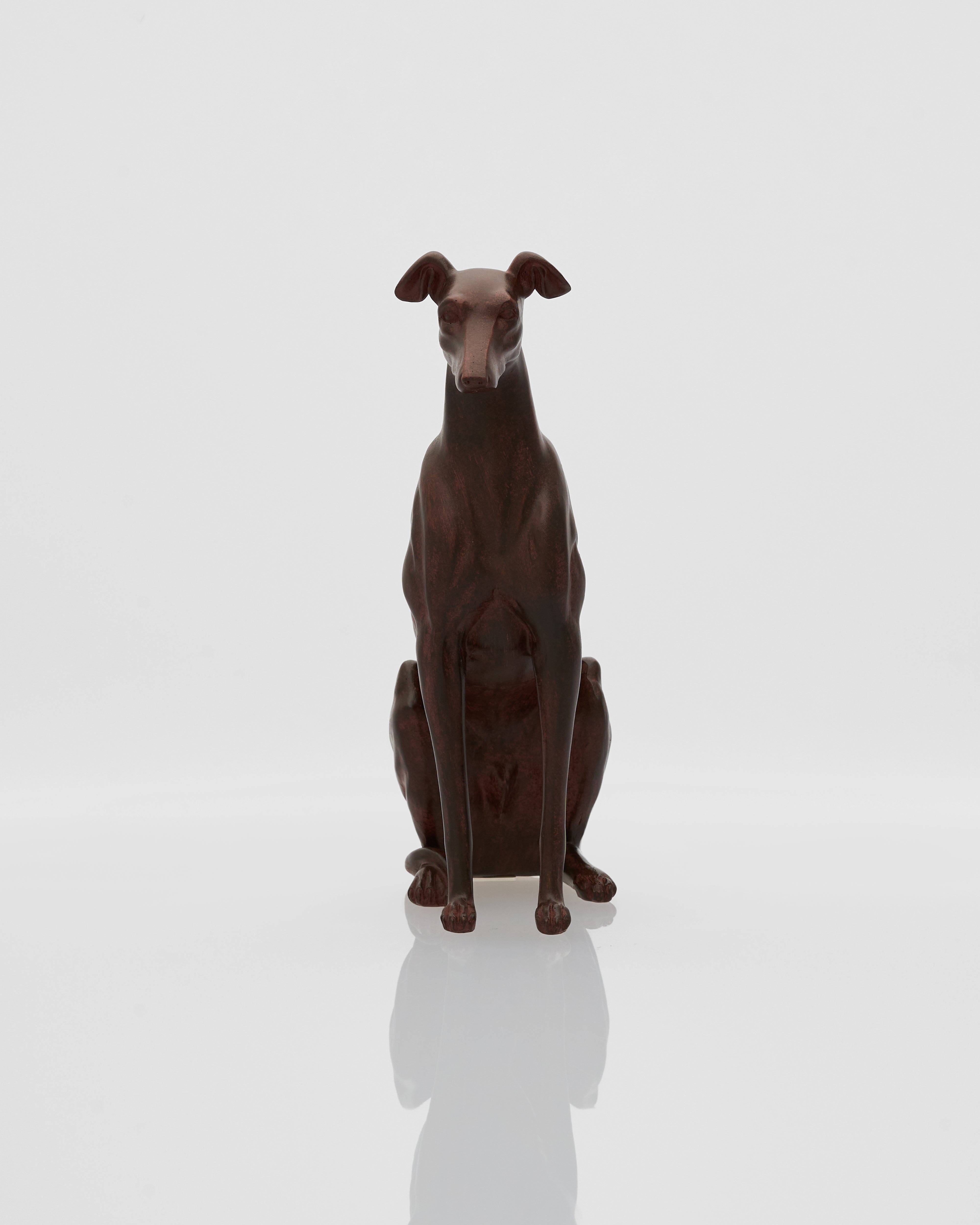Statue of a sitting dog on a white background