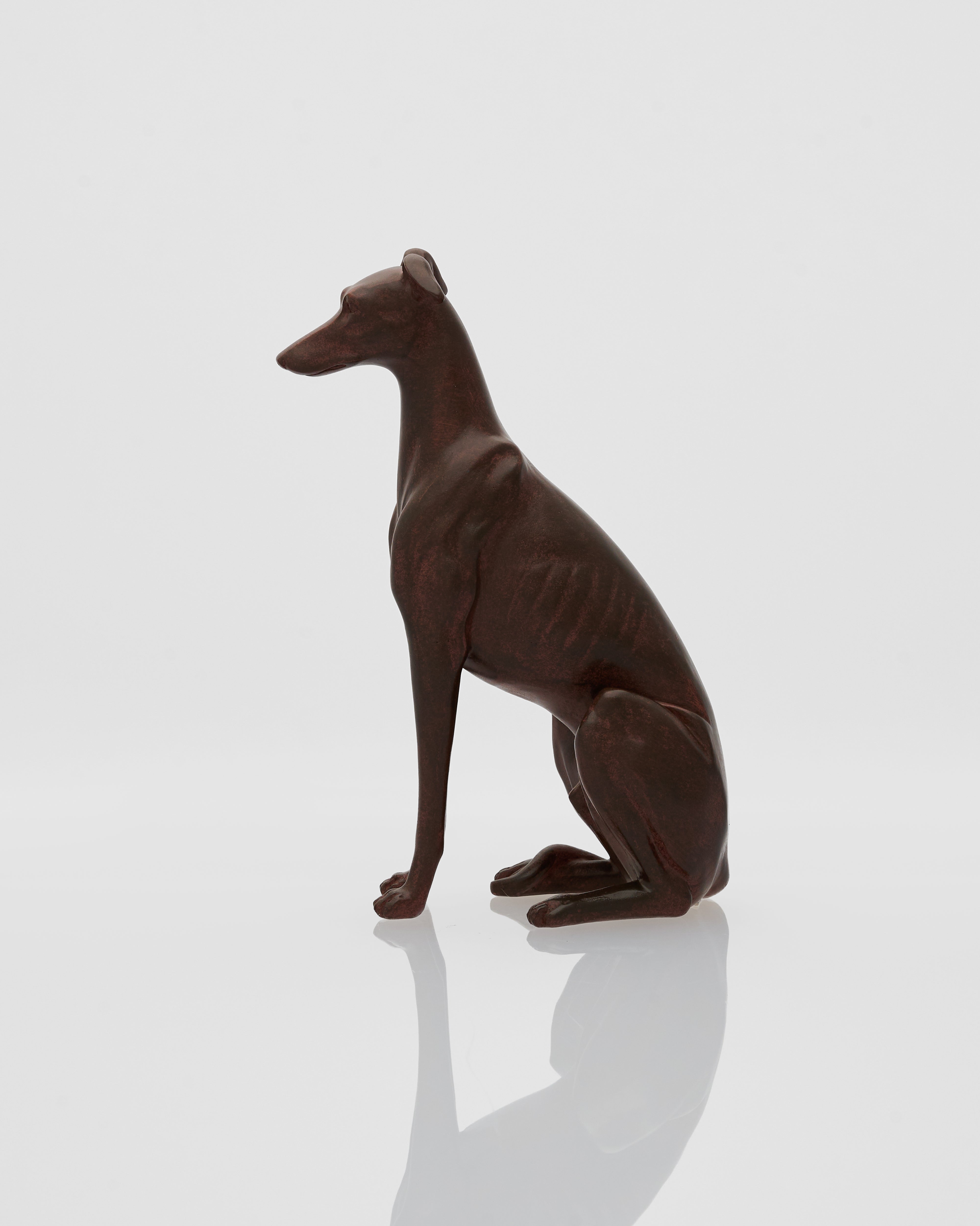 wooden sculpture of a sitting dog on a white background