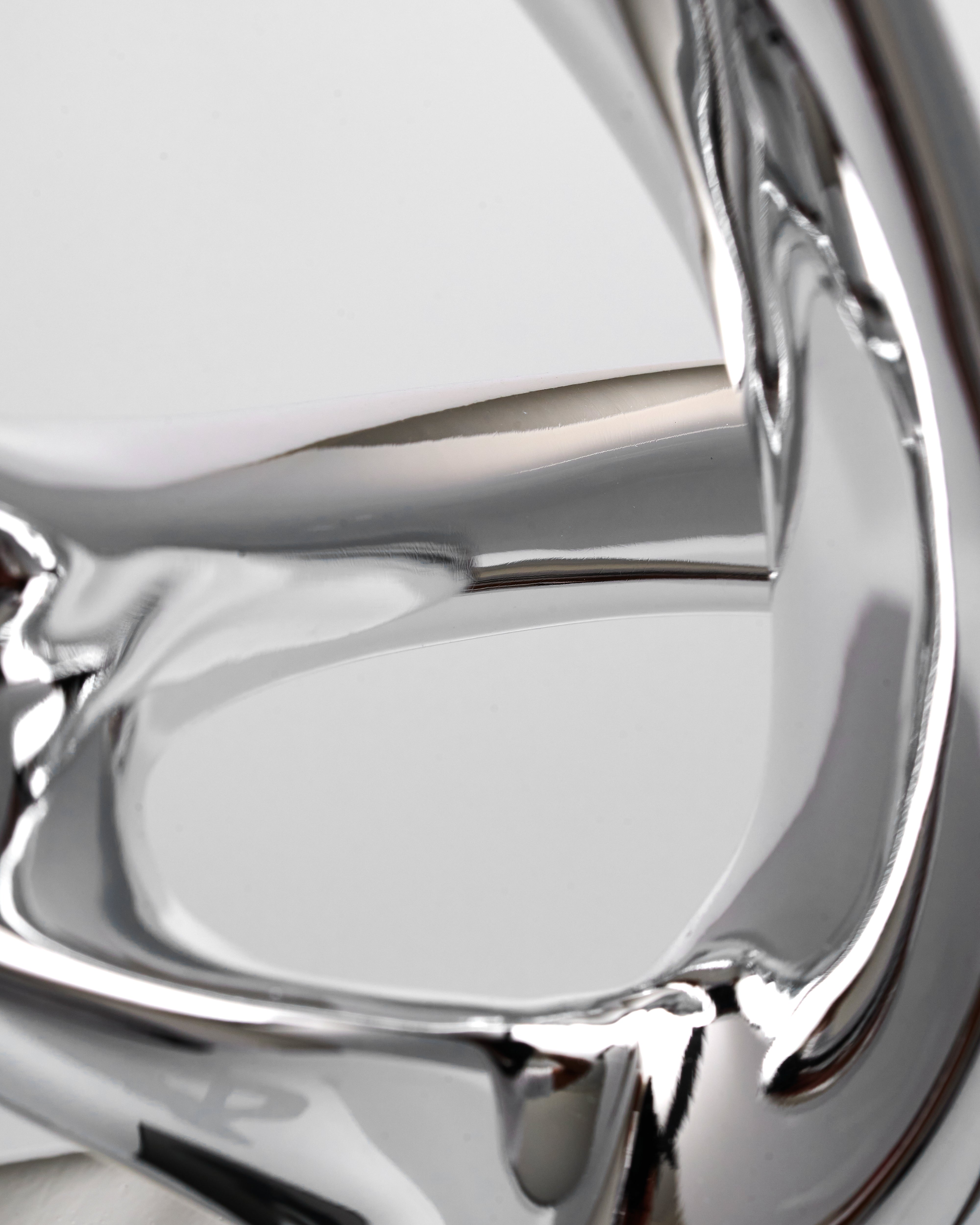 Close-up of a shiny resin object with reflective surface